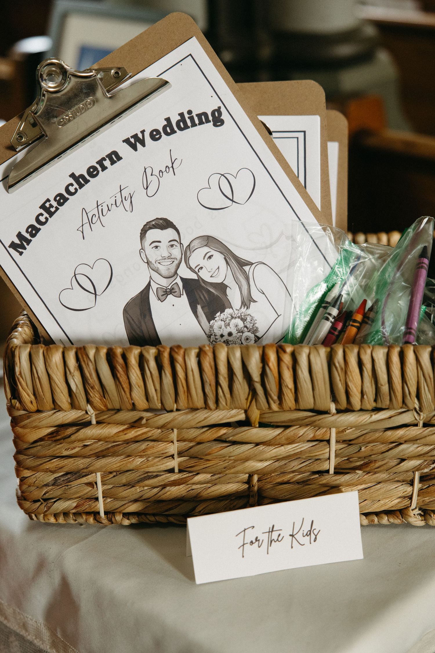 Wedding programs and cards displayed in a rustic woven basket.