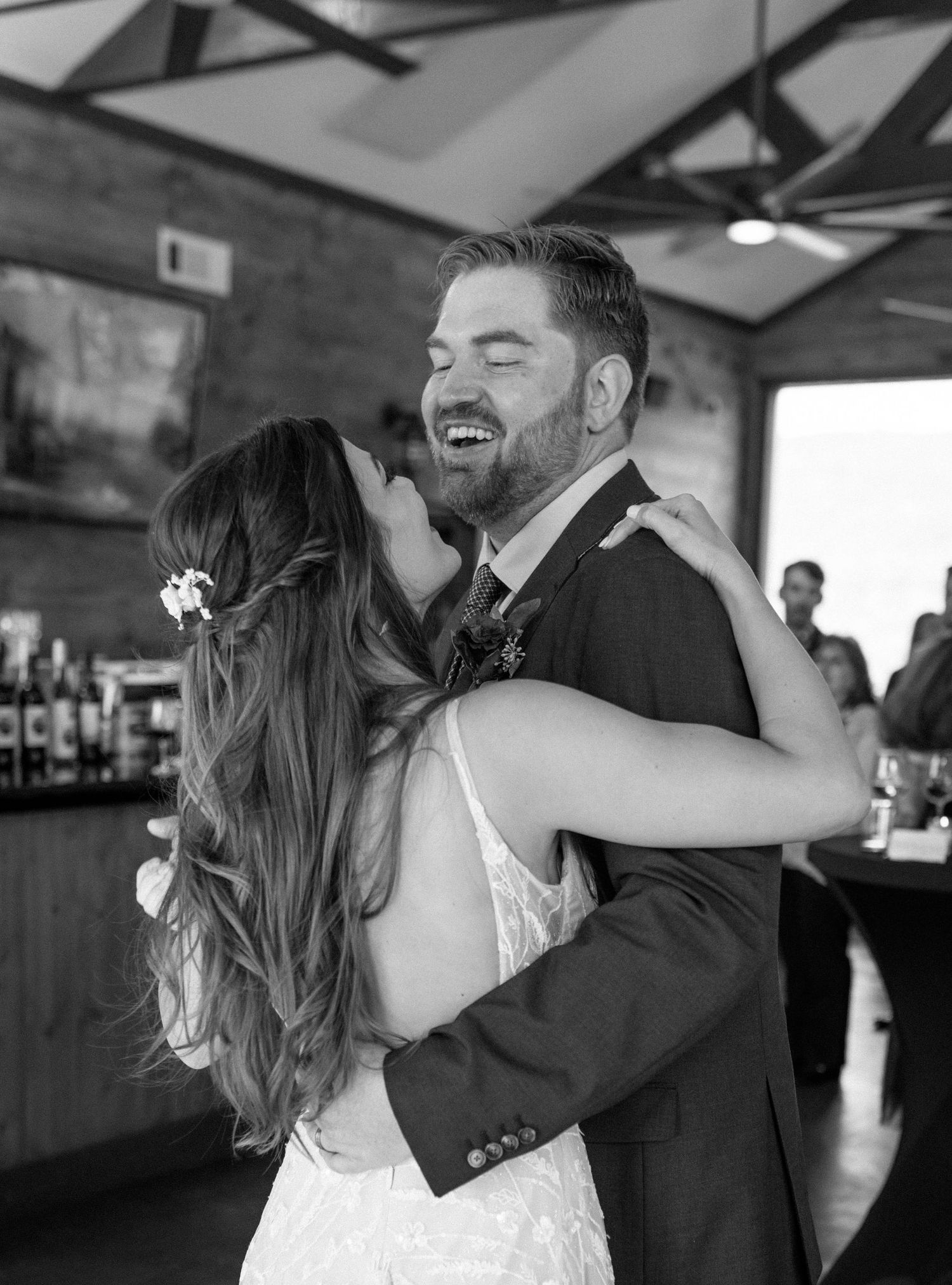A series of candid dance moments between a couple in formal wedding attire showing joyful movement and laughter.
