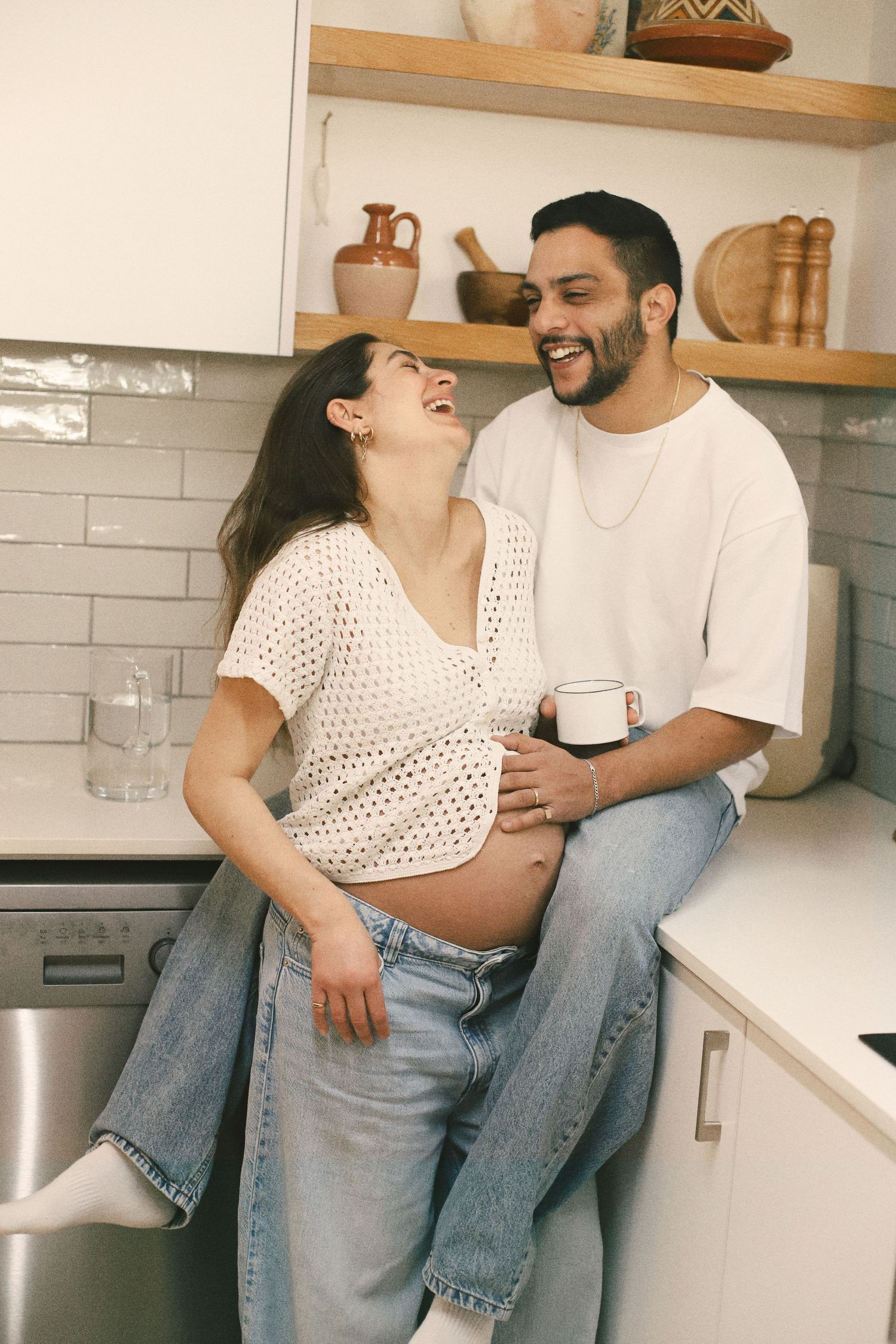 Couple sharing playful moment in kitchen