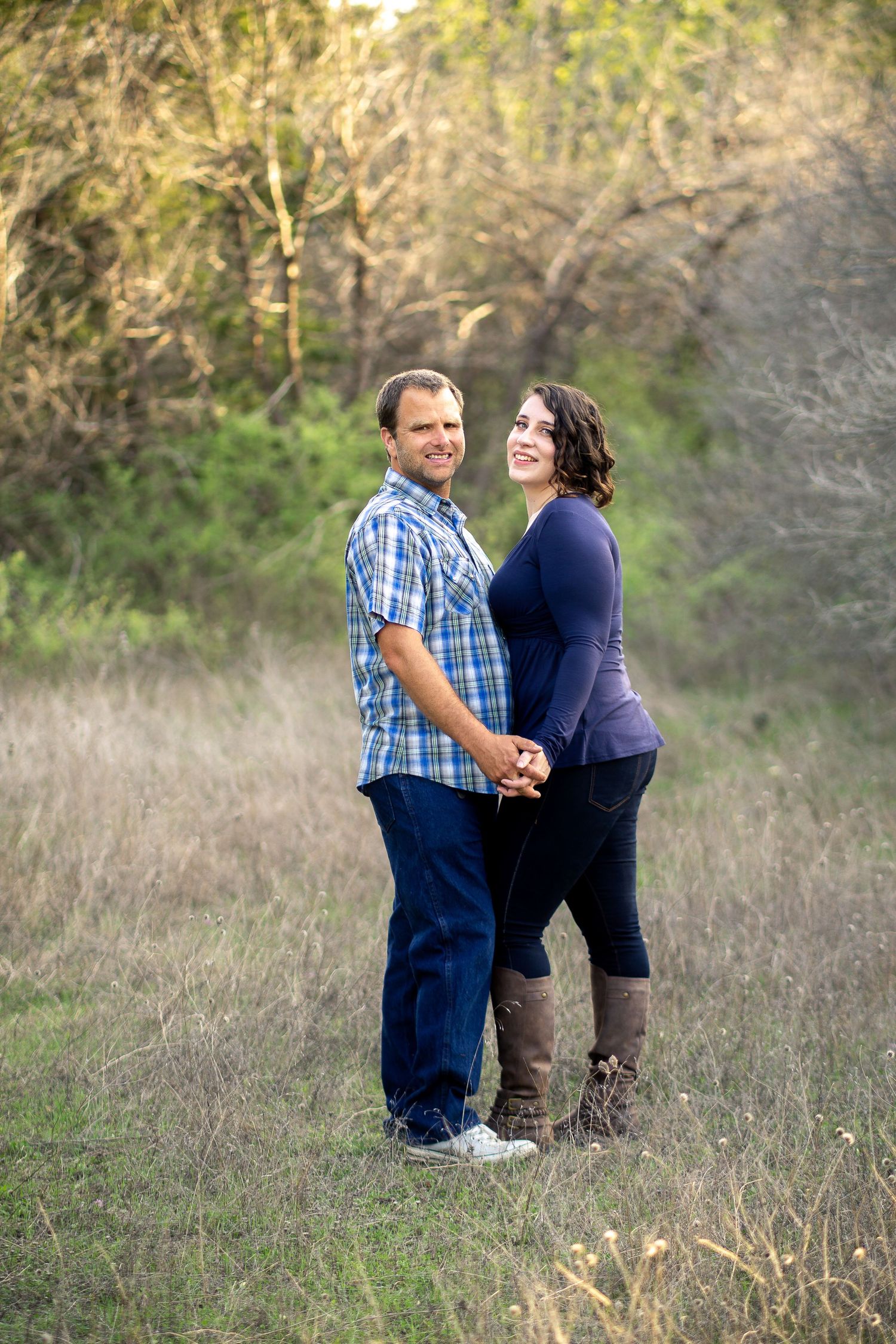 Couple standing together outside during portrait session in central Texas