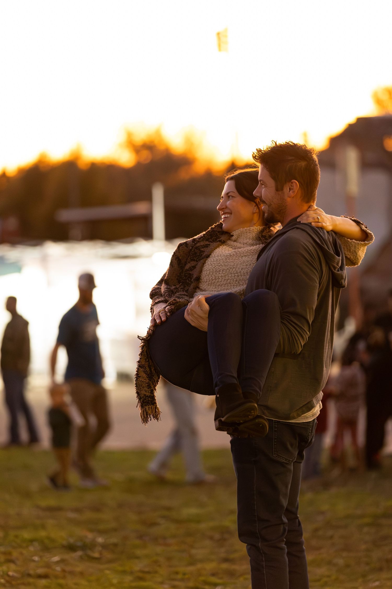 Man holding woman at community event