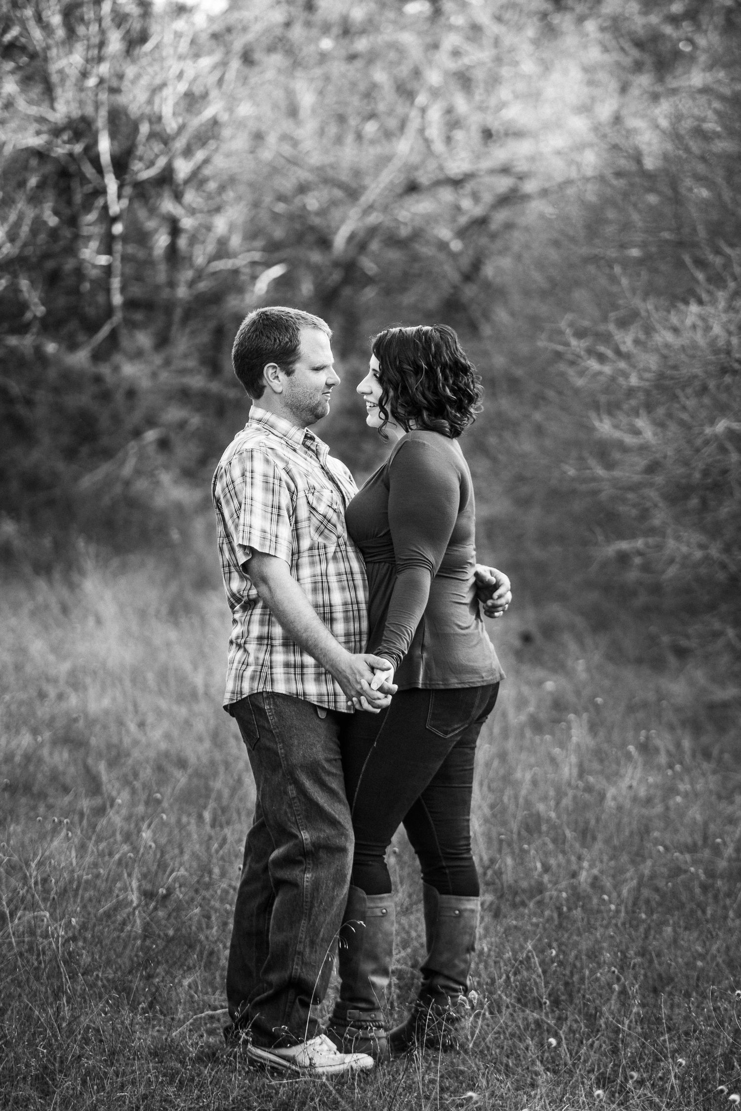Couple standing together outdoors during portrait session