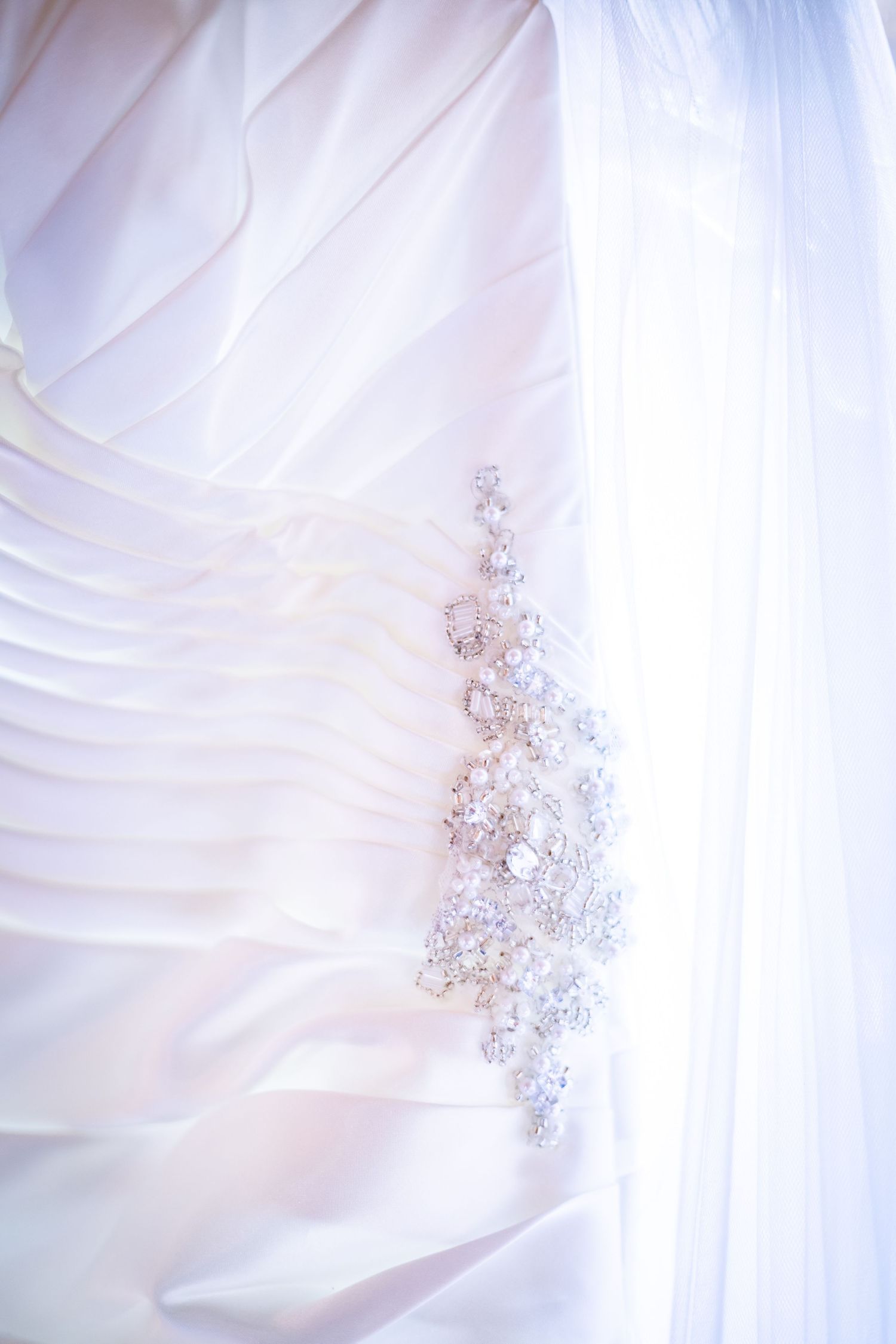 Delicate white flower petals with soft pink hues create an ethereal macro photography composition.