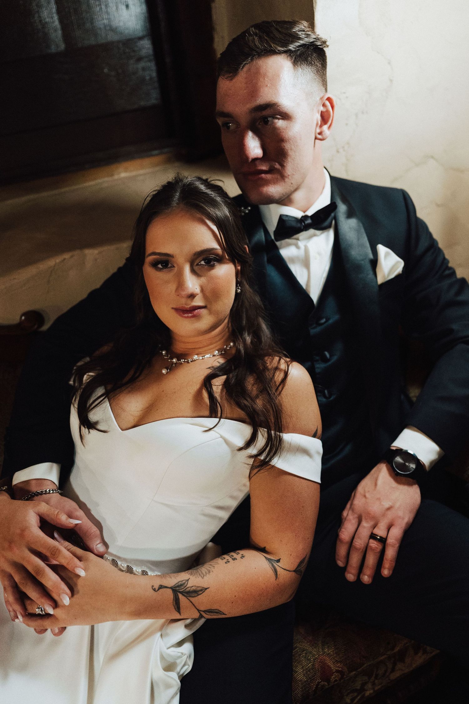 Bride and Groom portrait sitting on couch at wedding venue Three Gables Barn in Dillsburg, PA