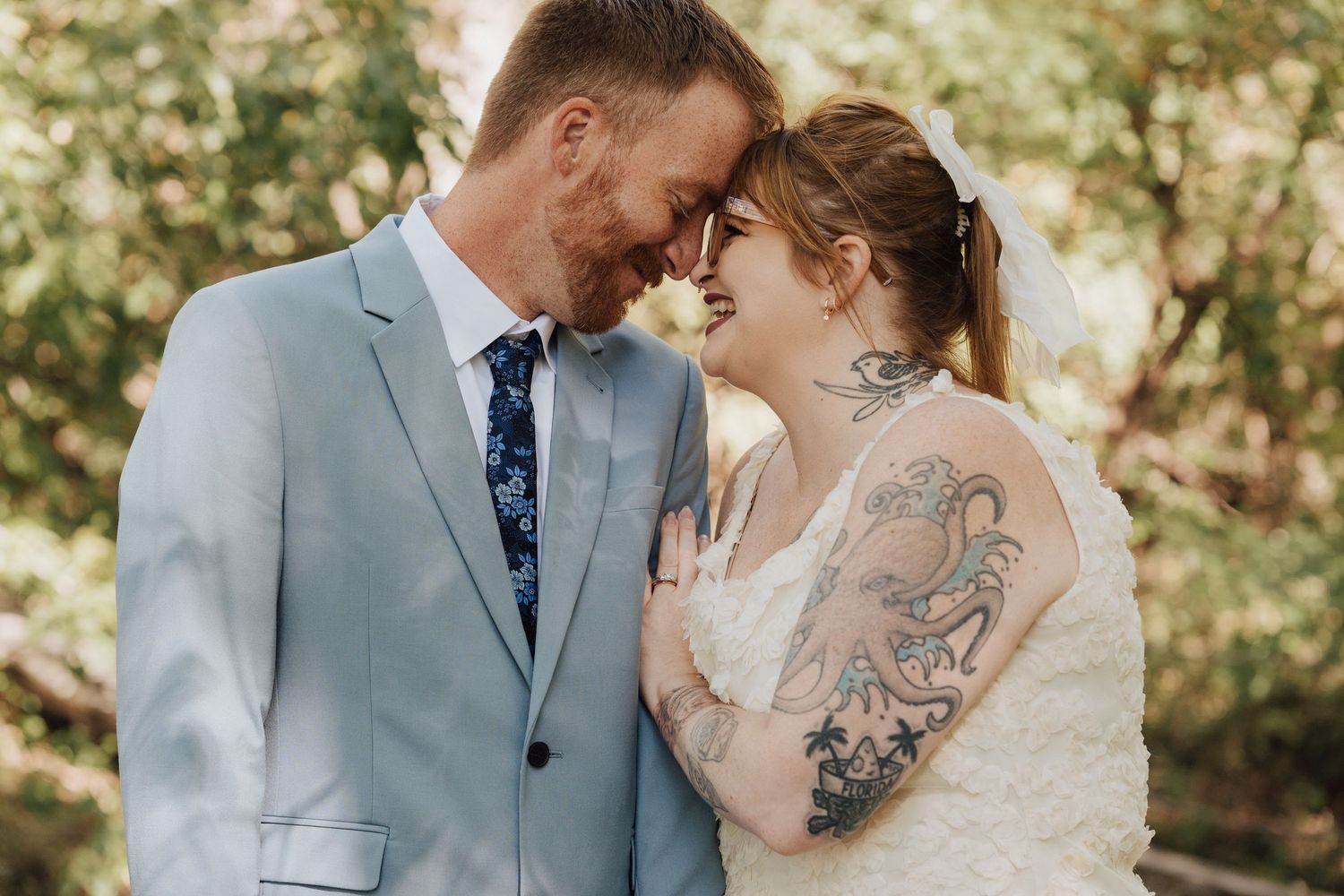 Newlyweds smiling at each other for elopement photoshoot