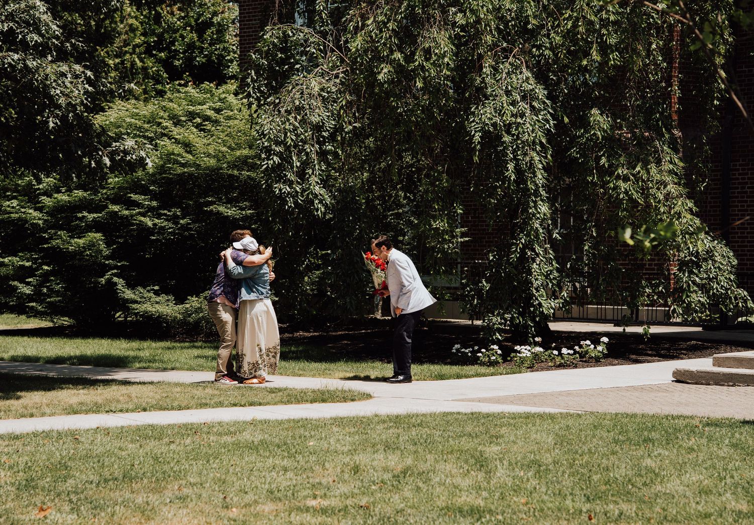 best friends hugging after engagement proposal at Gettysburg College, PA.