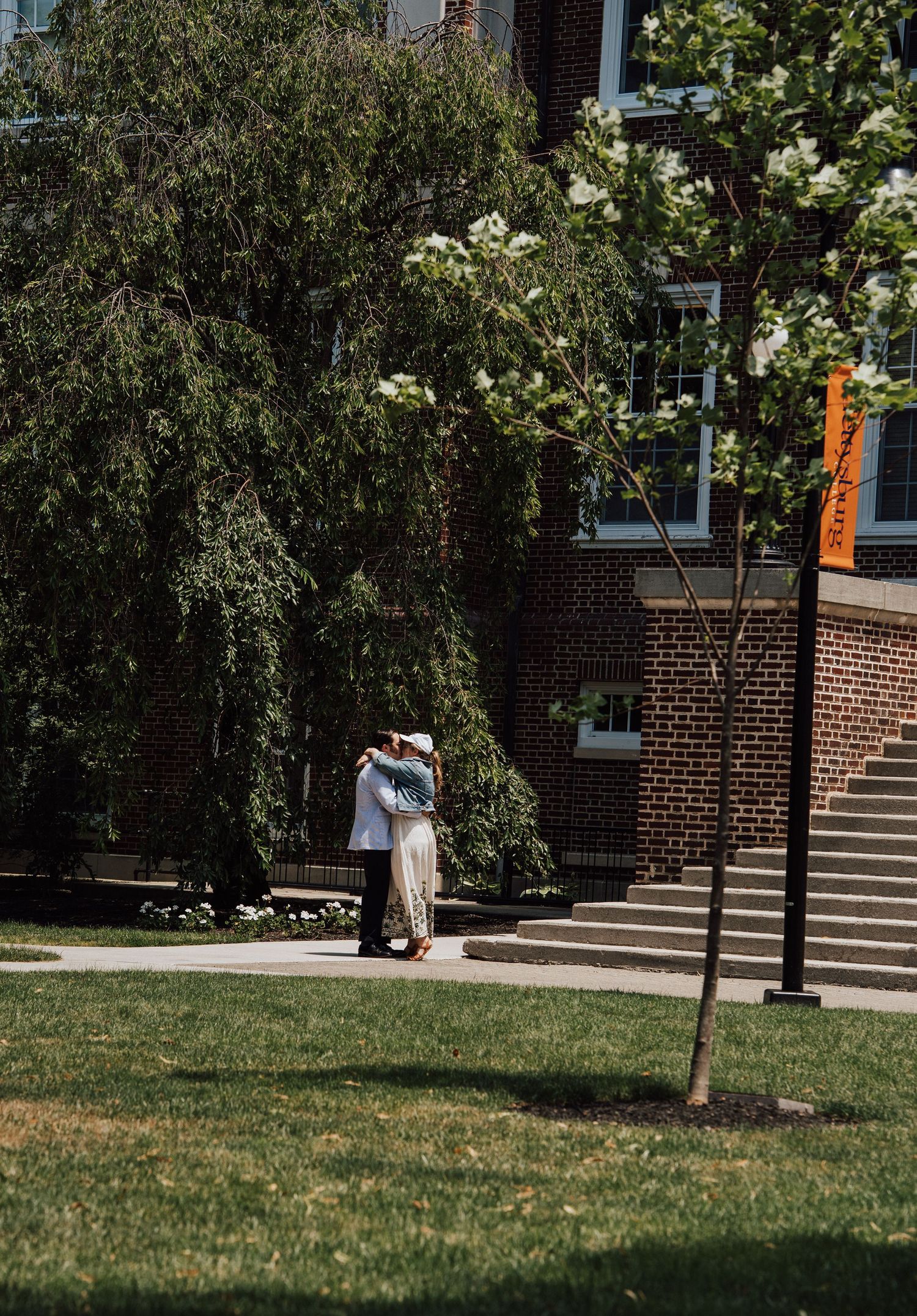 romantic couple kissing after engagement proposal at Gettysburg College in PA.