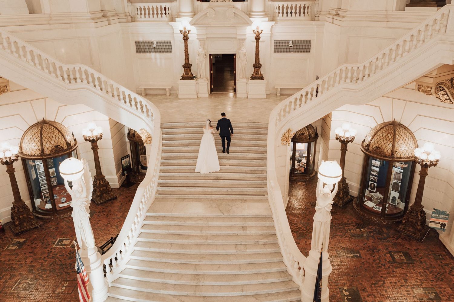 Elegant portrait of bride and groom walking at the Harrisburg Capitol Building after their elopement