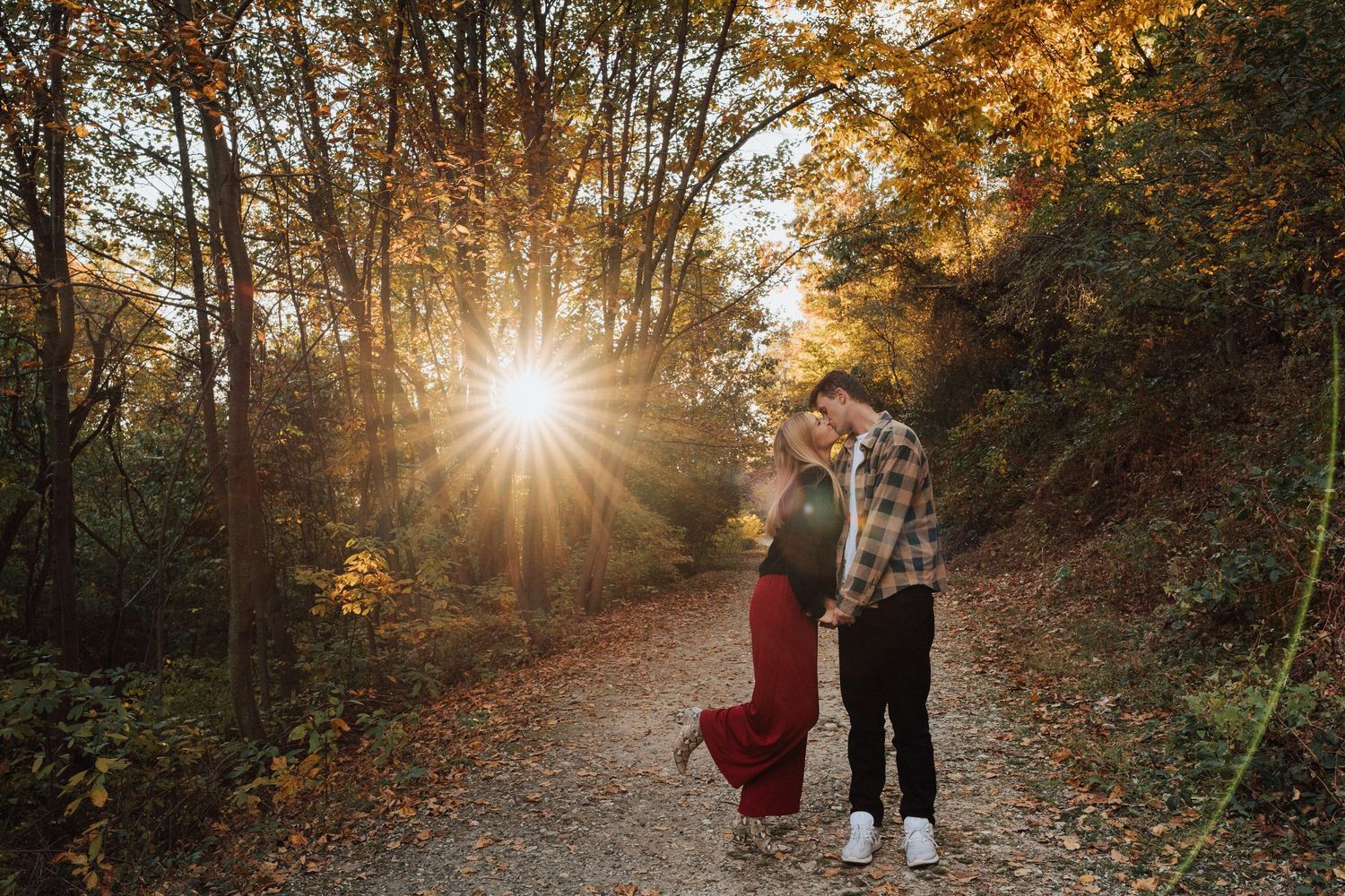 Engaged couple kissing during sunset for engagement photoshoot at Chickies Rock Overlook in Columbia, PA
