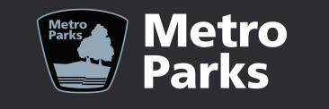 Metro Parks logo featuring a tree and landscape silhouette in a dark shield badge.