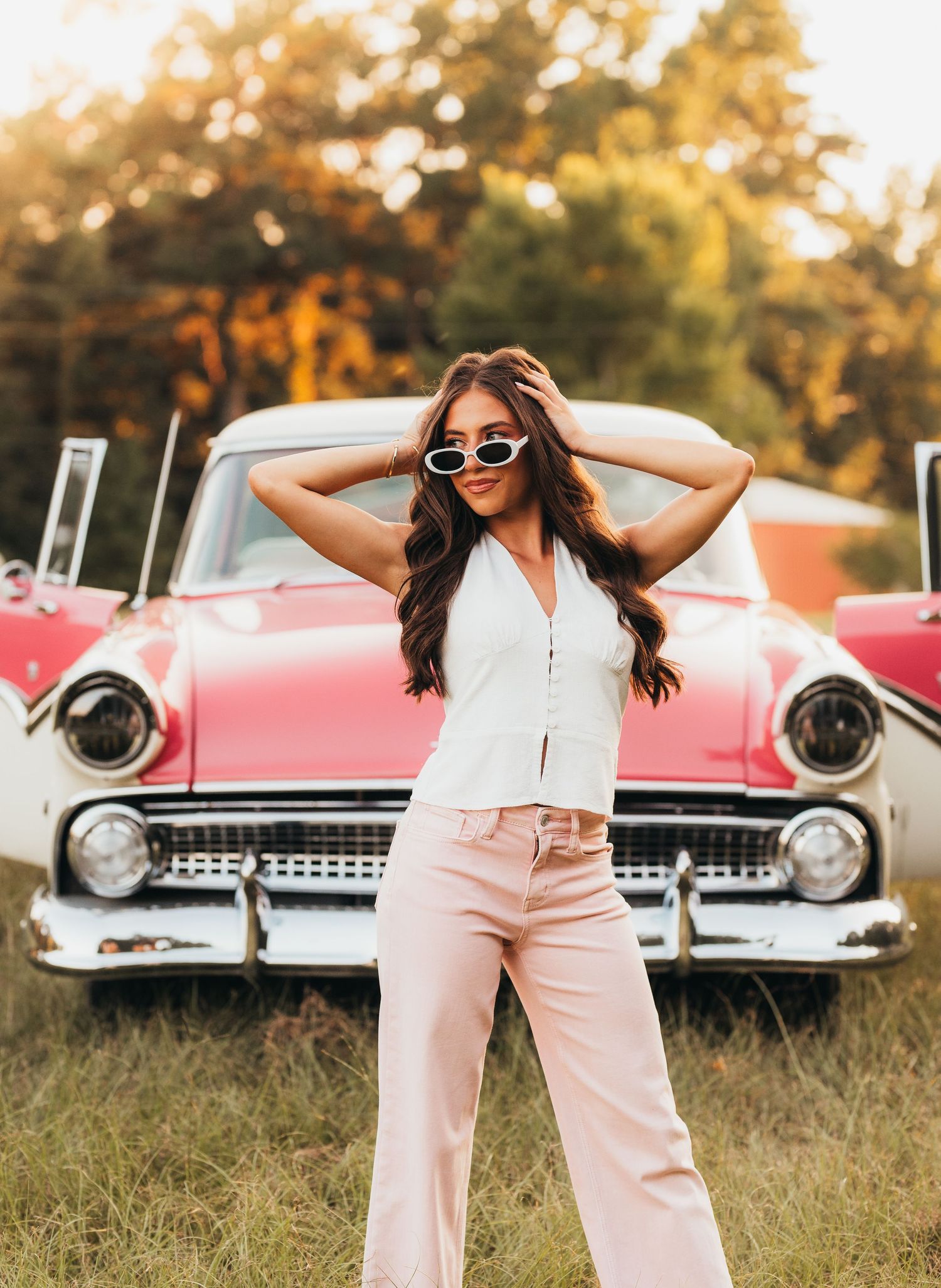 East Texas senior girl posing in front of a vintage truck during her senior portrait session