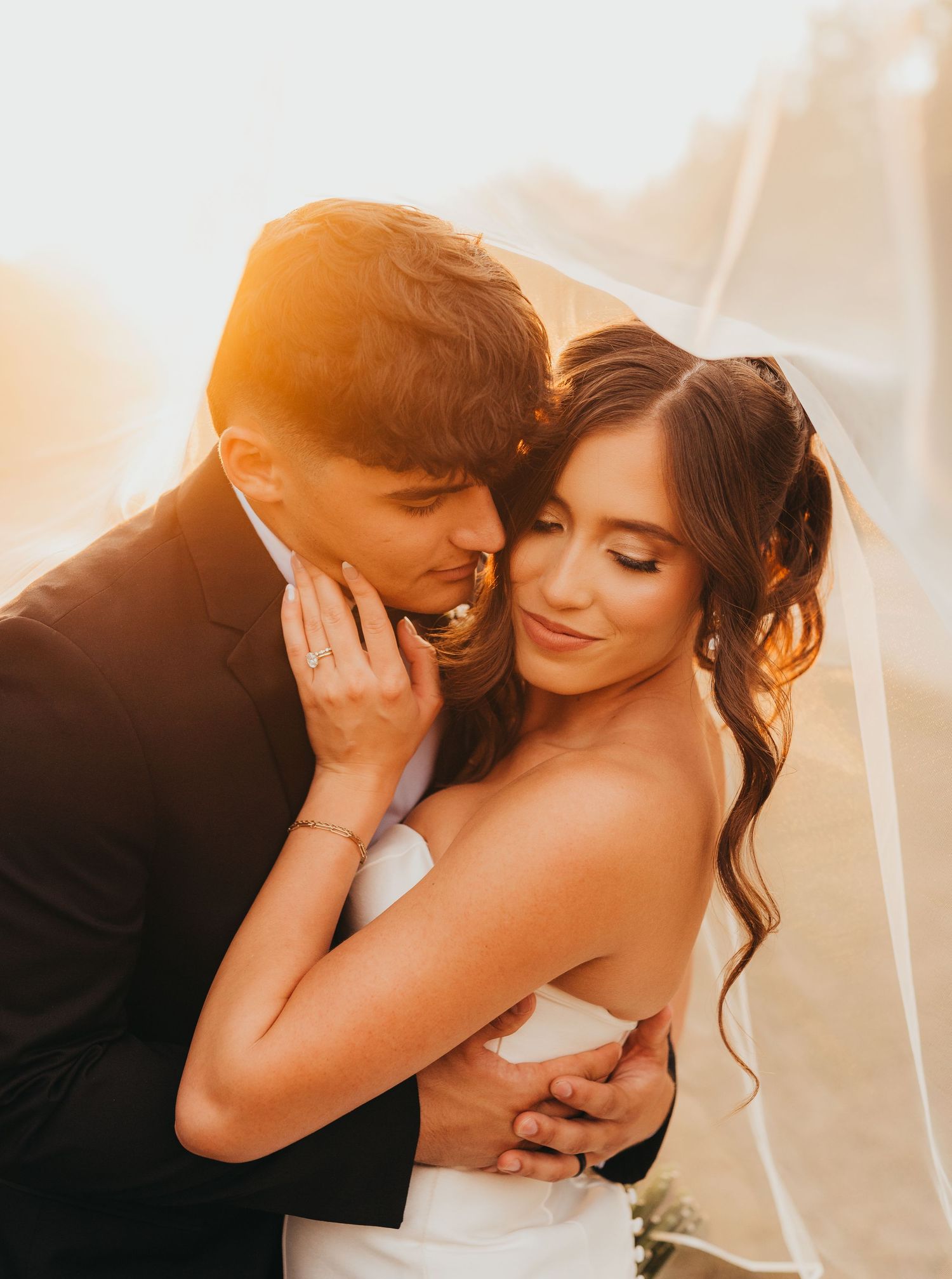 Bride and groom sharing a romantic moment during their wedding portraits | East Texas wedding photographer