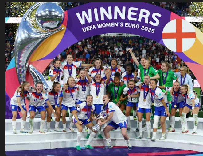 England women's football team celebrating as UEFA Women's Euro 2025 winners, lifting the trophy.