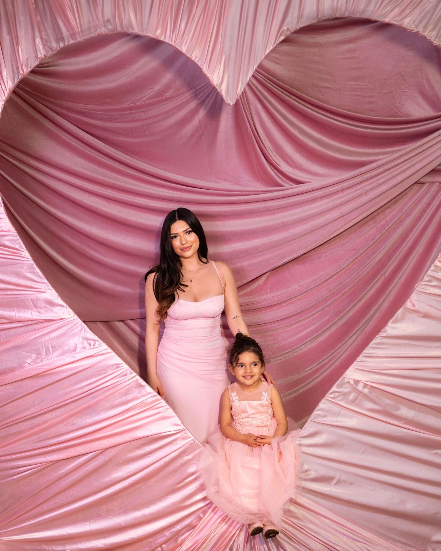 Girly Valentine’s heart wall with romantic draped fabric, perfect for feminine portraits, birthday shoots, Valentine’s Las Vegas