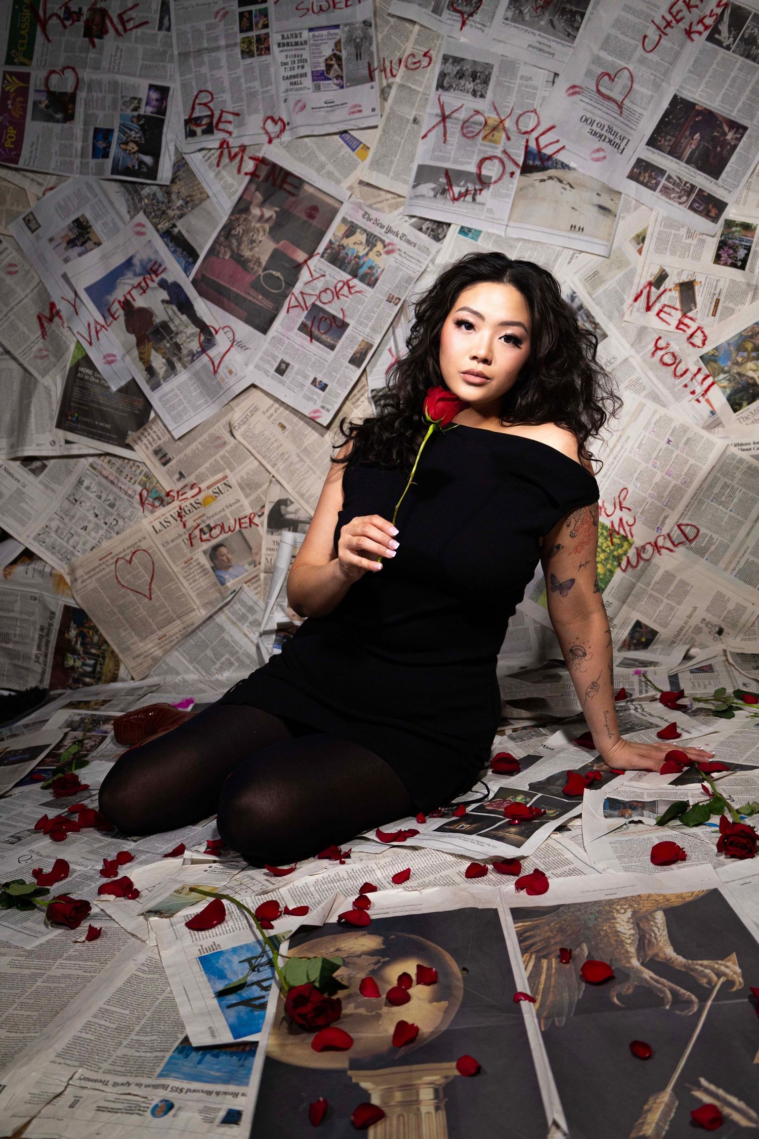 Floor-to-ceiling newspaper wall photography set, edgy fashion, editorial, streetwear, birthday, and creative photoshoots in Las Vegas