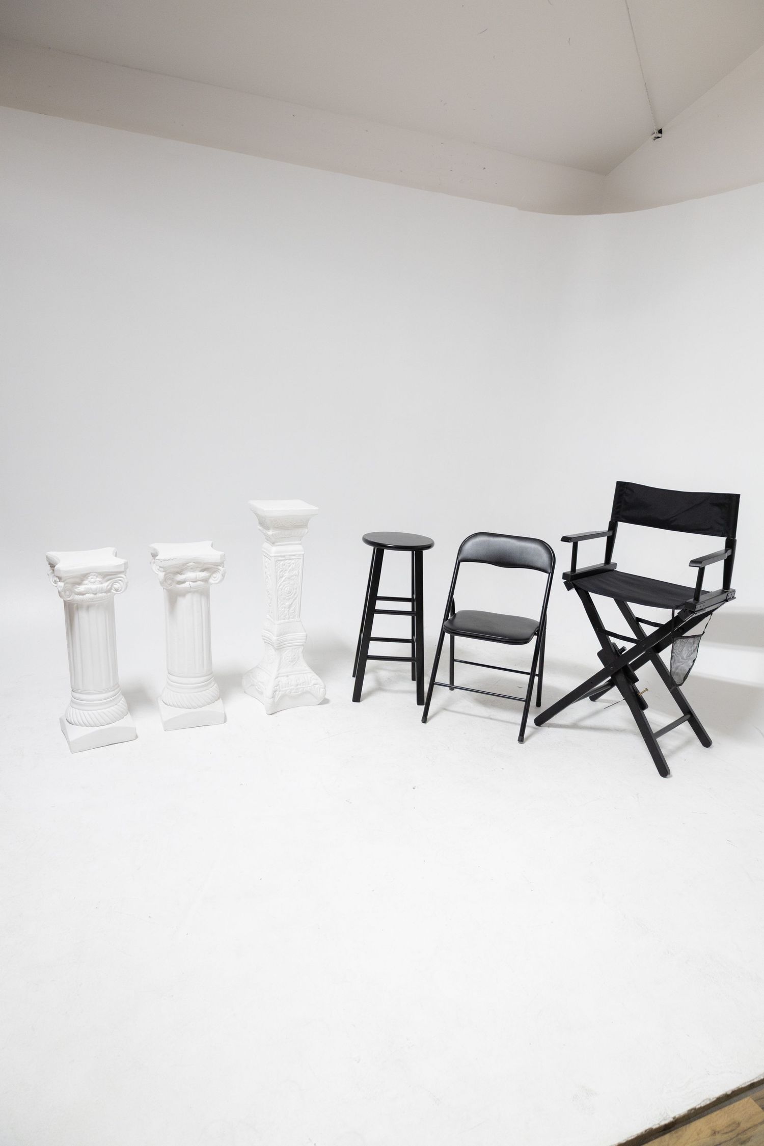 White wall photography set with spotlight lighting, offering a clean and versatile space for creative portraits, , fashion in las vegas