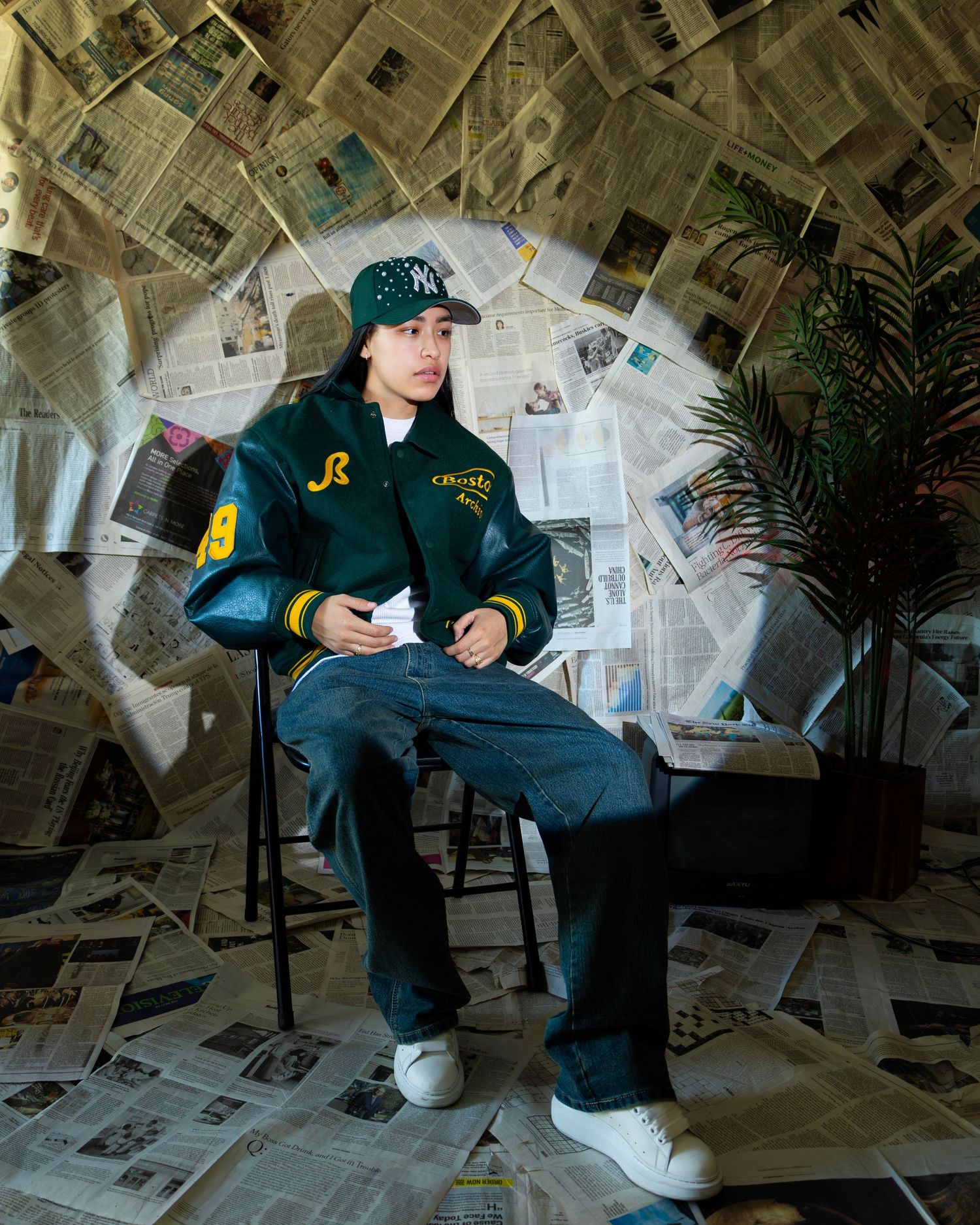 Floor-to-ceiling newspaper wall photography set, edgy fashion, editorial, streetwear, birthday, and creative photoshoots in Las Vegas