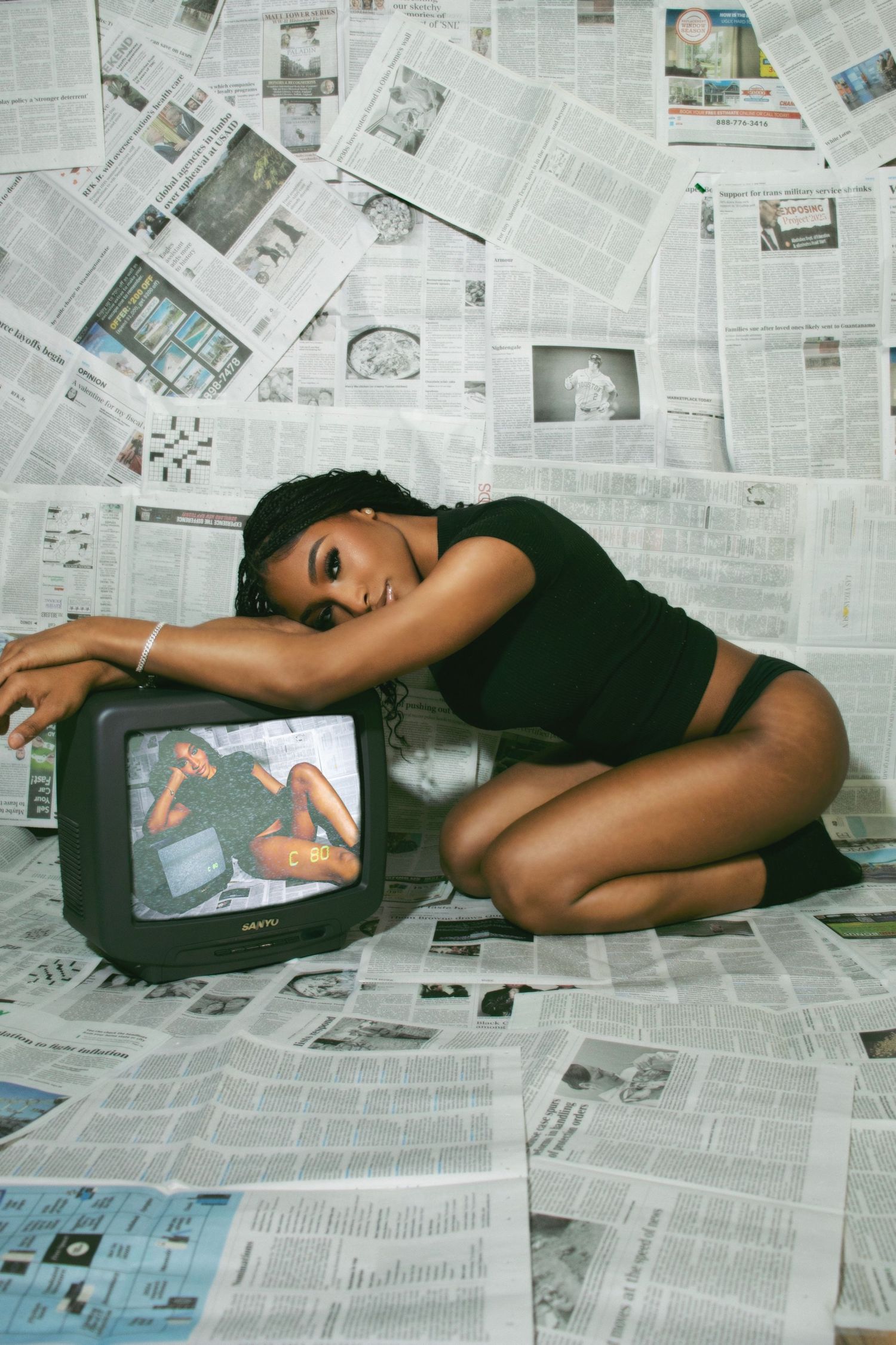 Floor-to-ceiling newspaper wall photography set, edgy fashion, editorial, streetwear, birthday, and creative photoshoots in Las Vegas