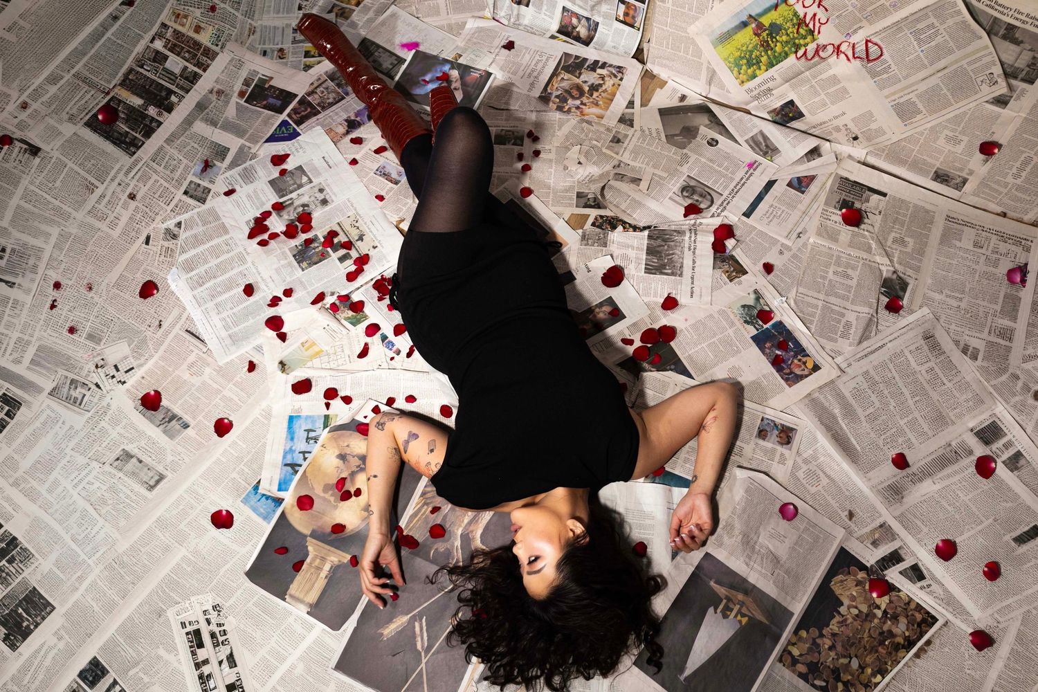 Floor-to-ceiling newspaper wall photography set, edgy fashion, editorial, streetwear, birthday, and creative photoshoots in Las Vegas