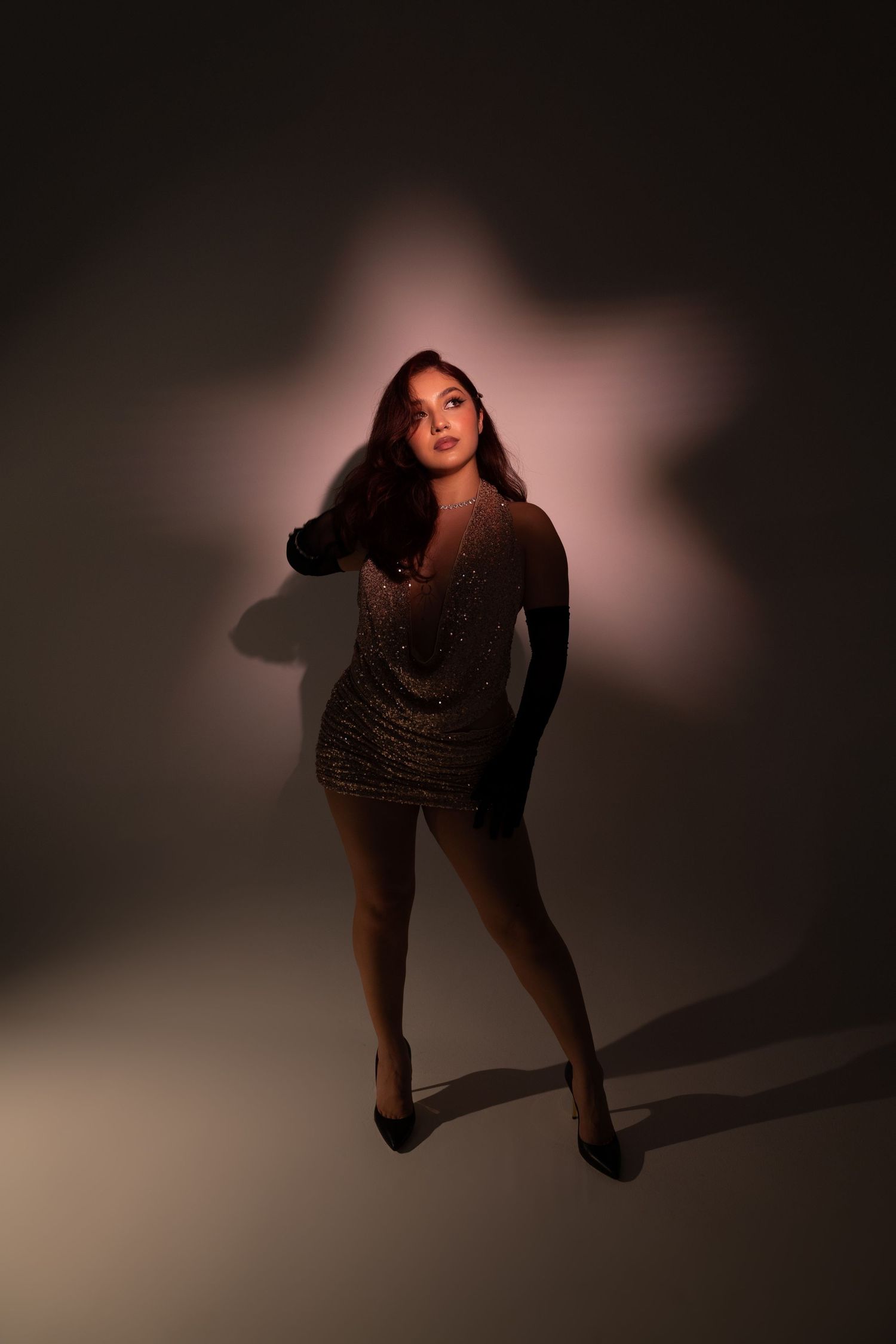 White wall photography set with spotlight lighting, offering a clean and versatile space for creative portraits, , fashion in las vegas