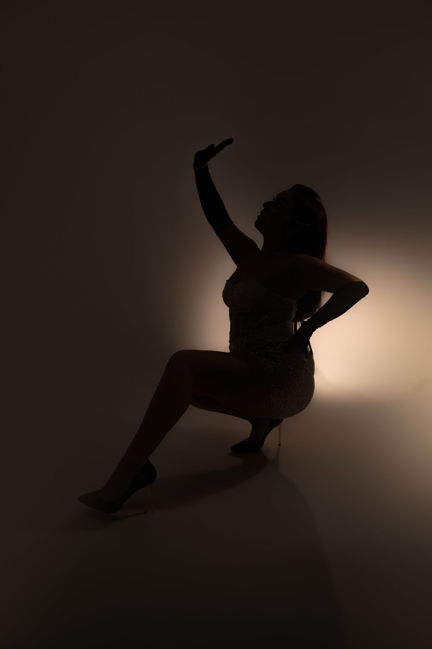 White wall photography set with spotlight lighting, offering a clean and versatile space for creative portraits, , fashion in las vegas