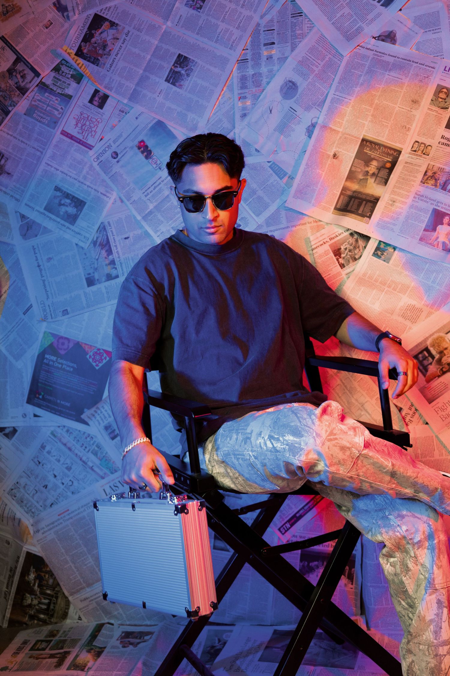 Floor-to-ceiling newspaper wall photography set, edgy fashion, editorial, streetwear, birthday, and creative photoshoots in Las Vegas