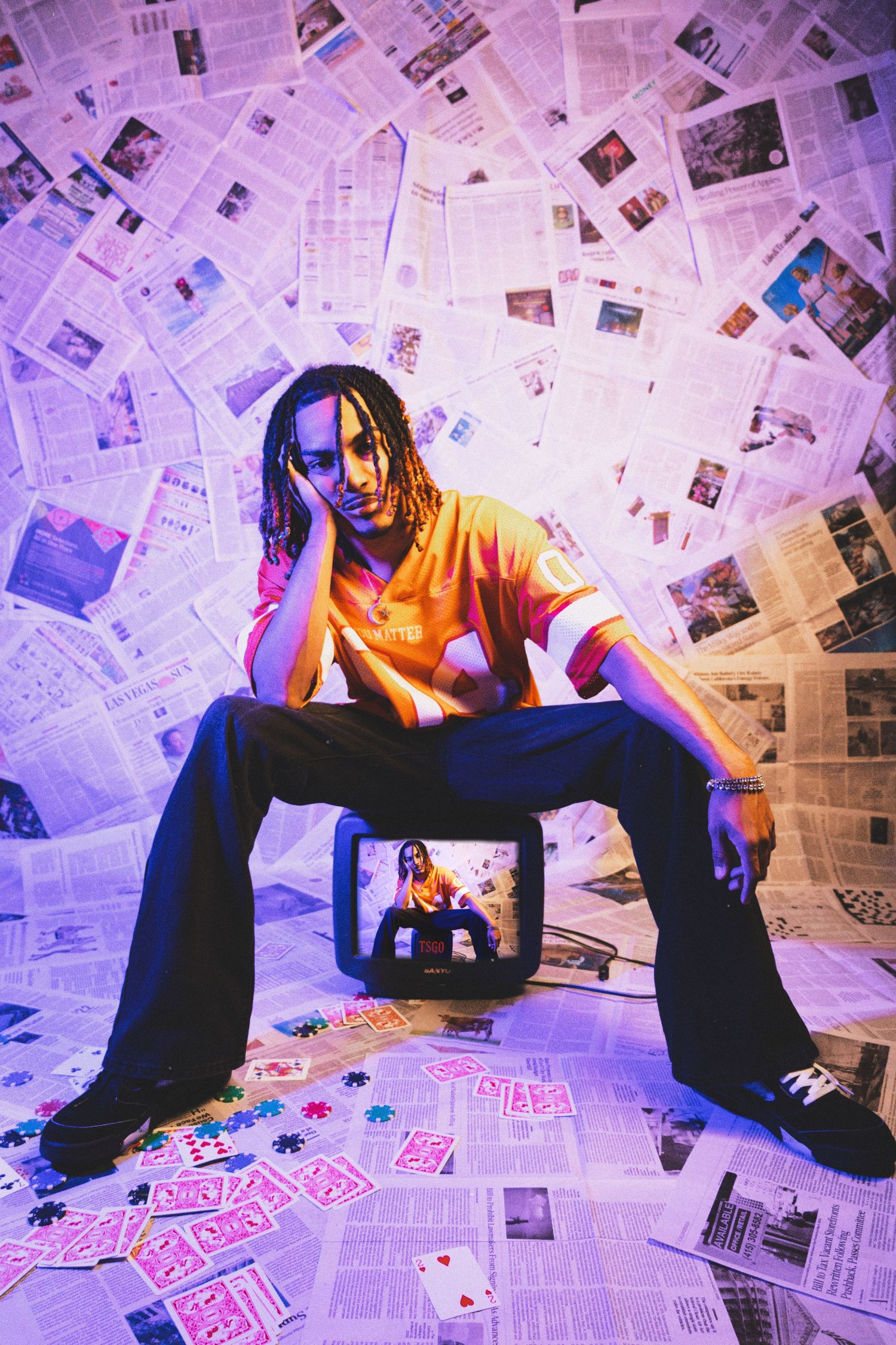 Floor-to-ceiling newspaper wall photography set, edgy fashion, editorial, streetwear, birthday, and creative photoshoots in Las Vegas