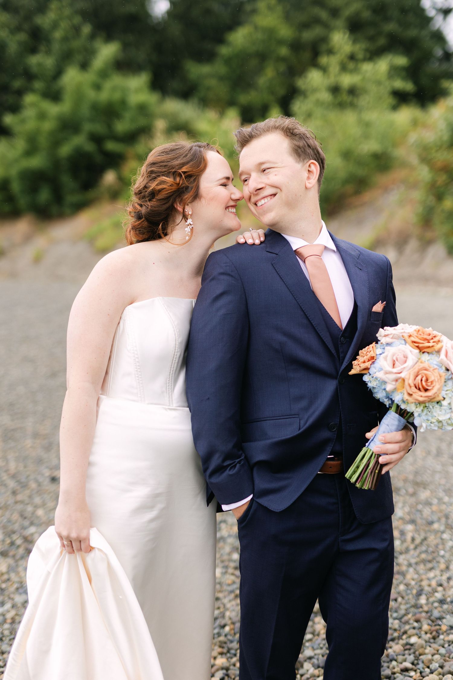 A romantic sequence of wedding photos showing a couple sharing tender kisses on a rocky beach.