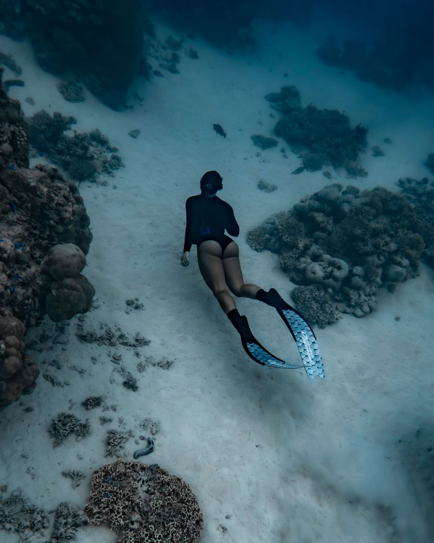 Cinematic underwater photo, in a documentary style, magical underwater photoshoot. Destination Elopement, maternity underwater photographer