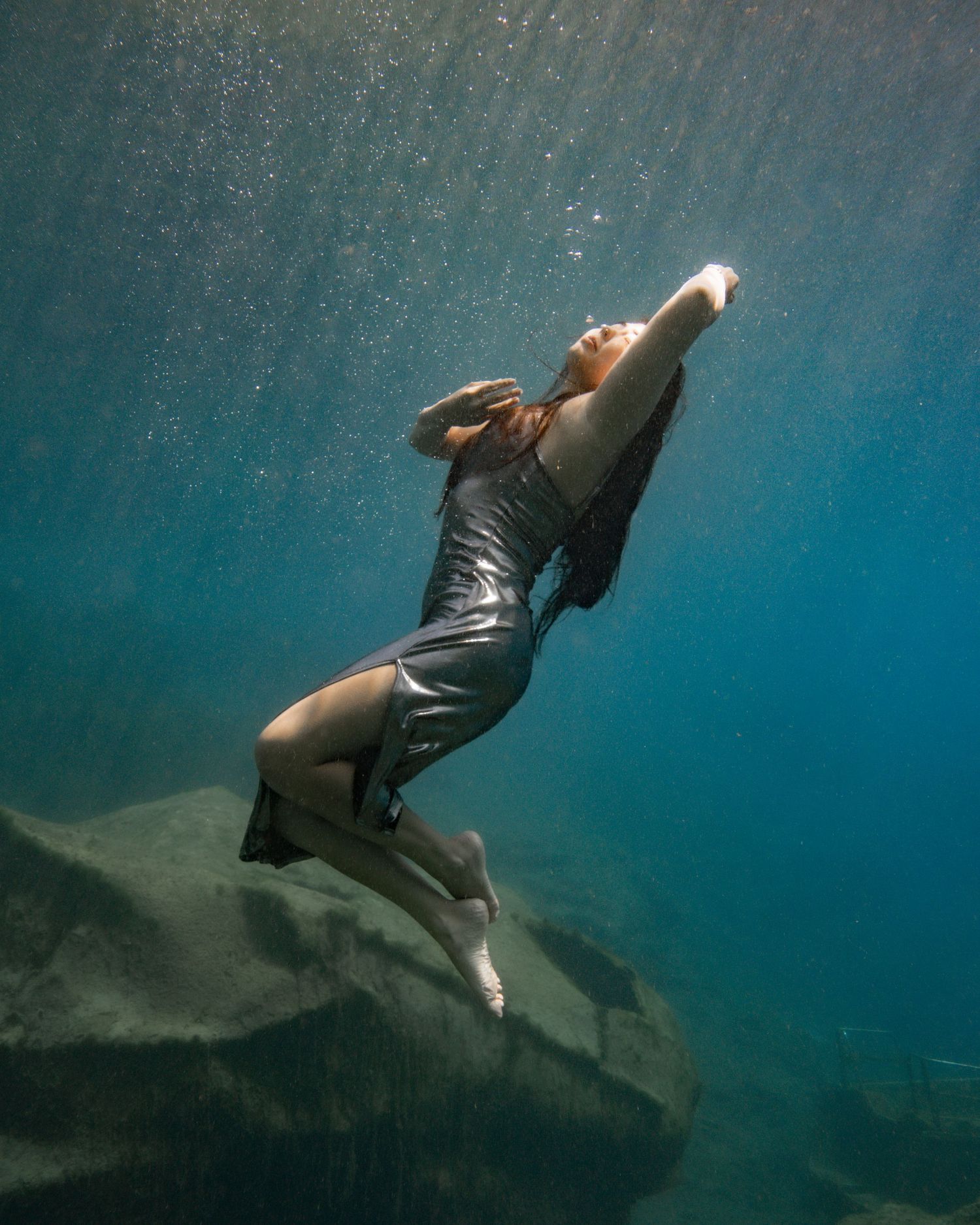 Cinematic underwater photo, in a documentary style, magical underwater photoshoot. Destination Elopement, maternity underwater photographer