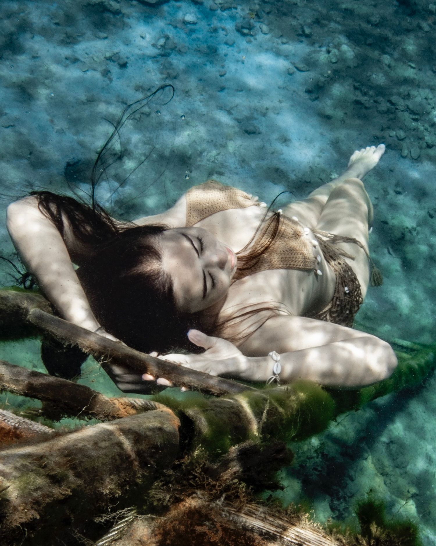 Cinematic underwater photo, in a documentary style, magical underwater photoshoot. Destination Elopement, maternity underwater photographer
