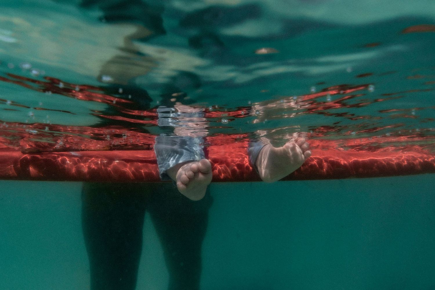 Cinematic underwater photo, in a documentary style, magical underwater photoshoot. Destination Elopement, maternity underwater photographer