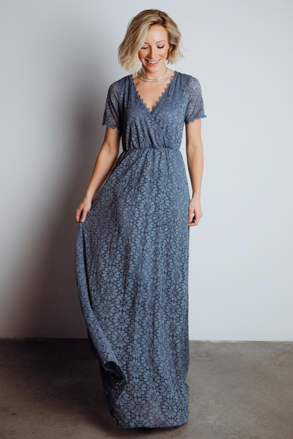 Navy blue floral maxi dress with short sleeves and empire waistline displayed from different views.
