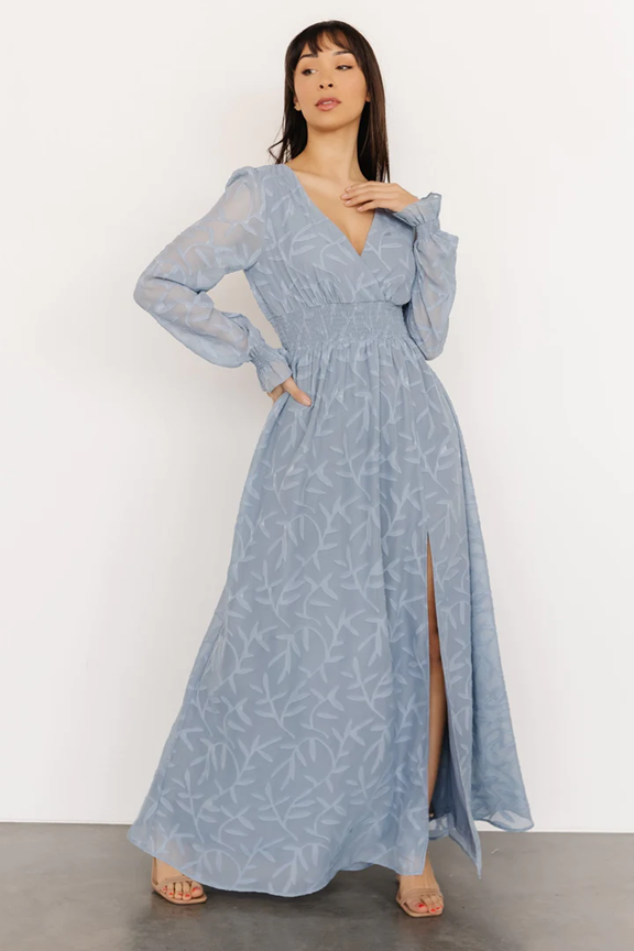 Light blue patterned maxi dress with long sleeves and front slit shown in various poses.