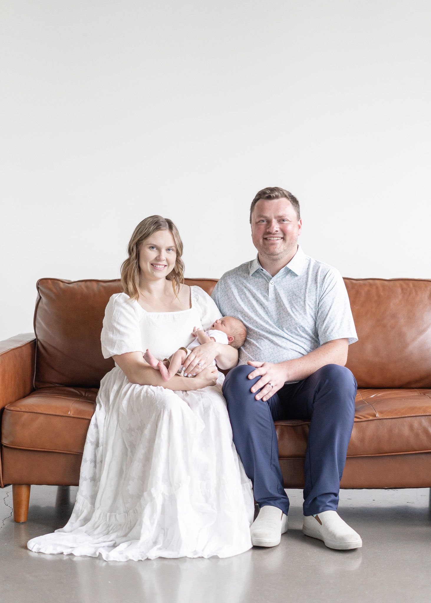 A series of four casual portraits showing people sitting together on a brown leather couch against a white background.