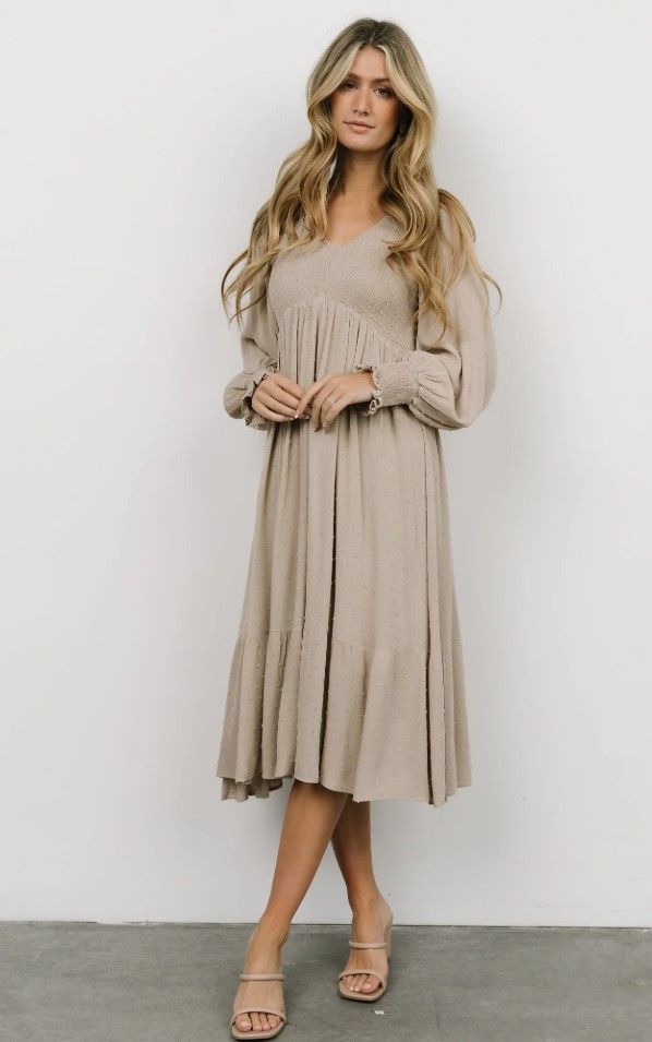 A flowy beige babydoll dress with long sleeves shown in different styling angles.