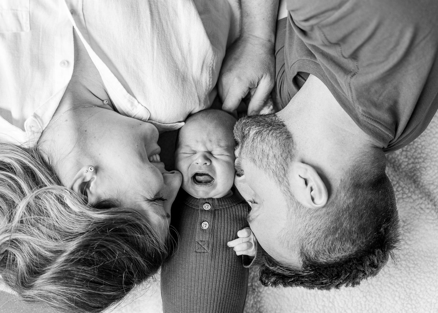 A series of black and white intimate photos showing tender moments between two people.