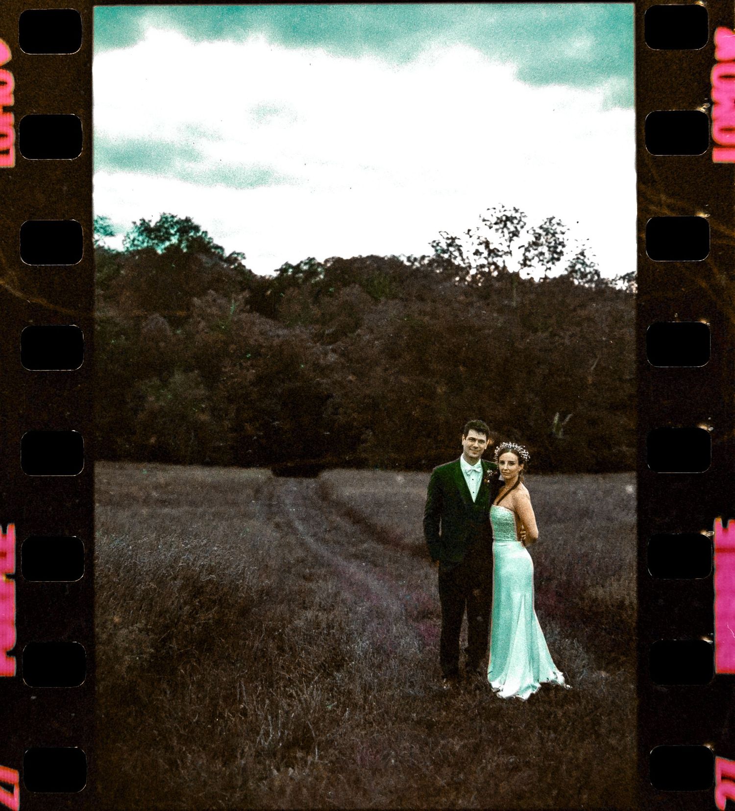 Bride and groom stand in a field at shady elm farms pittsburgh pa photography and video by EternalLensMedia.com