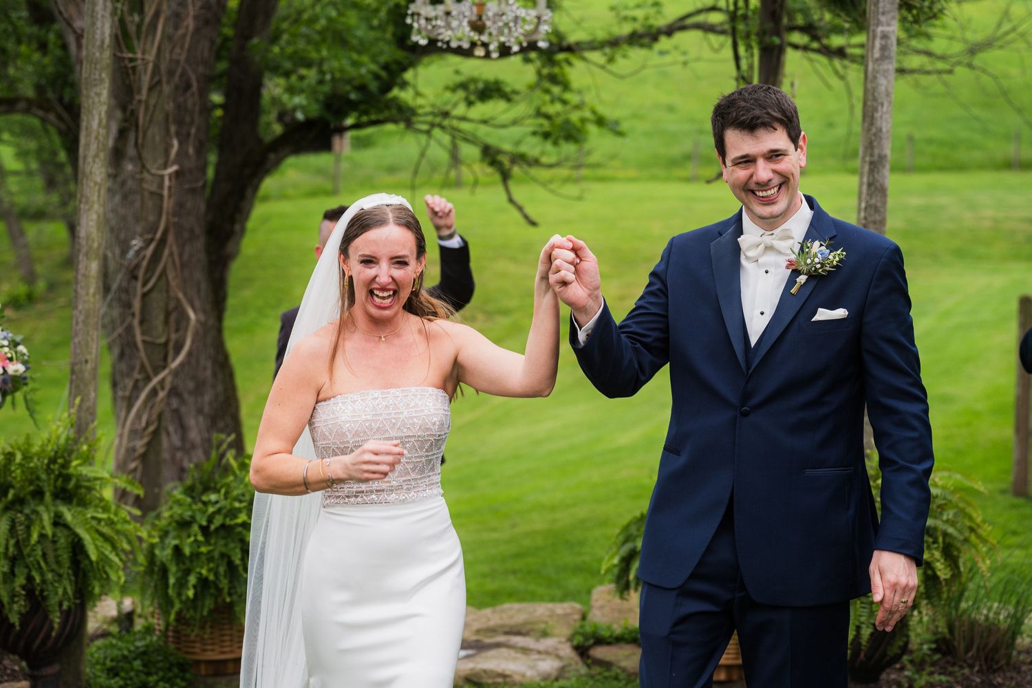 A celebratory moment captured outdoors with trees and green lawn in background.  at shady elms farm pittsburgh pa photography and video