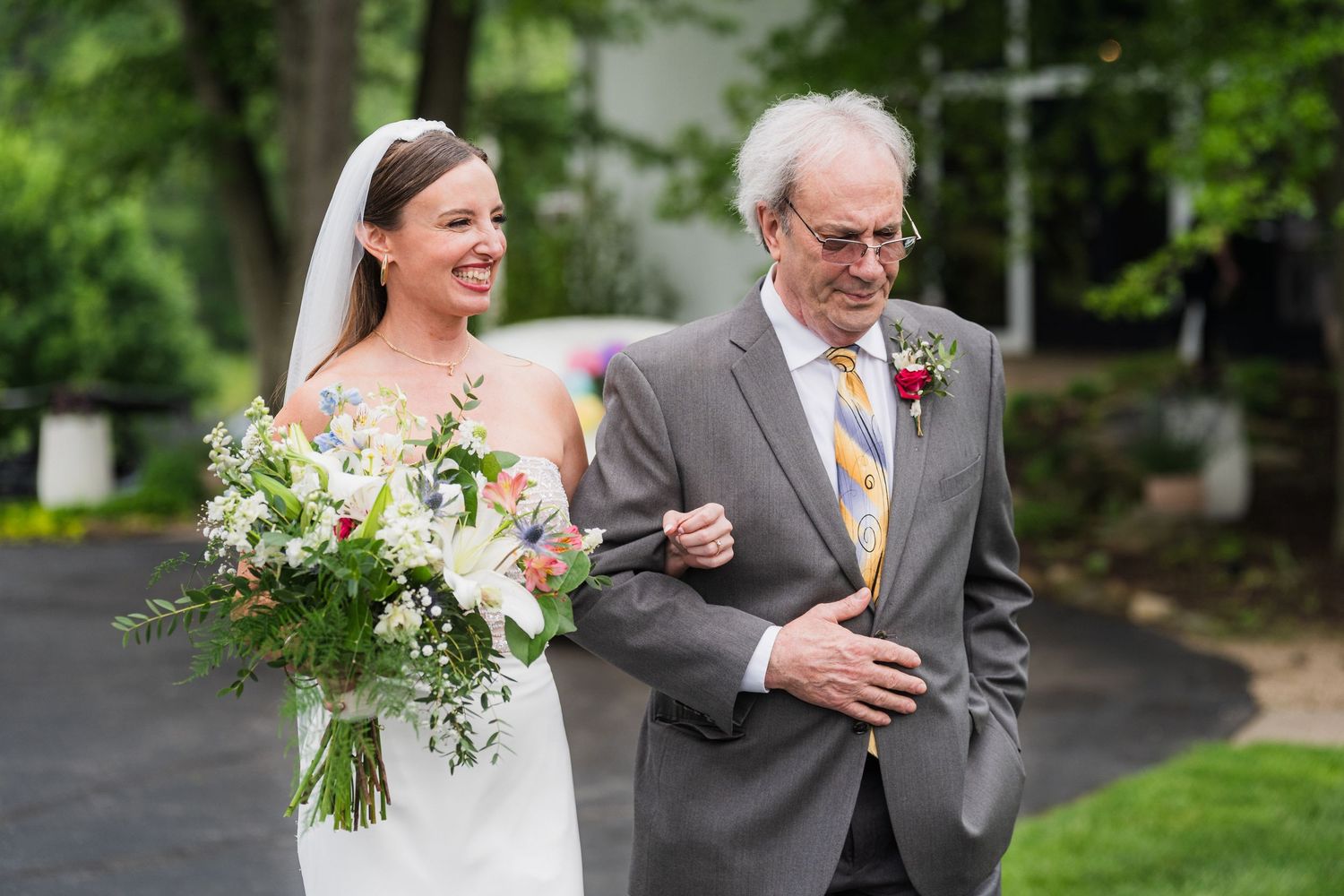 at shady elms farm pittsburgh pa photography and videoA joyful wedding moment captured on a rainy day with lush greenery backdrop.