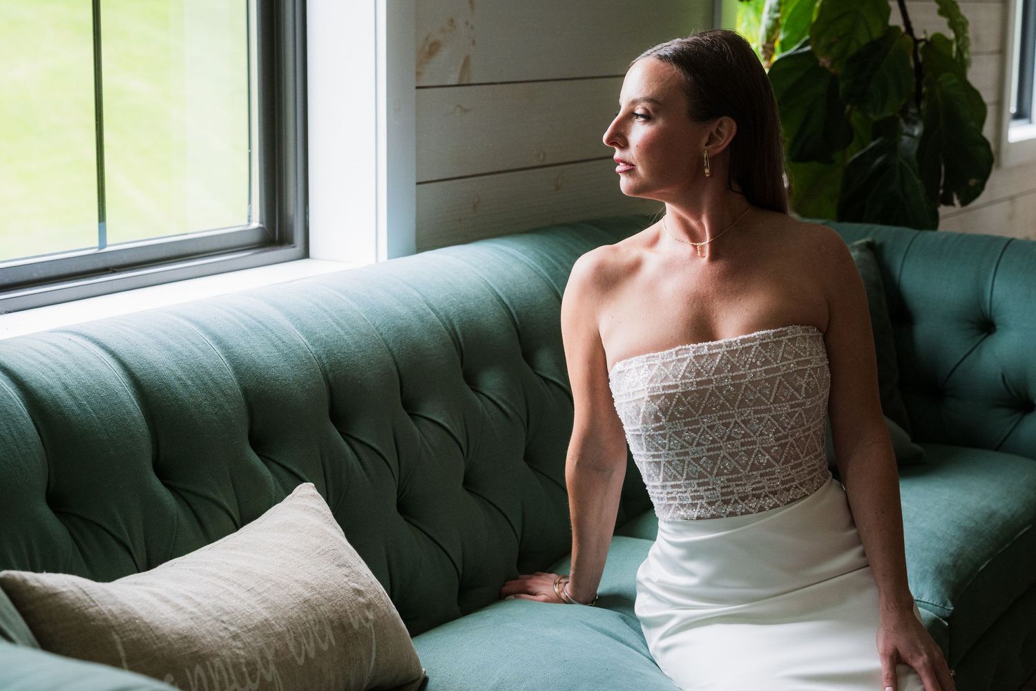 Elegant bridal portrait on teal velvet couch by window light.  at shady elms farm pittsburgh pa photography and video
