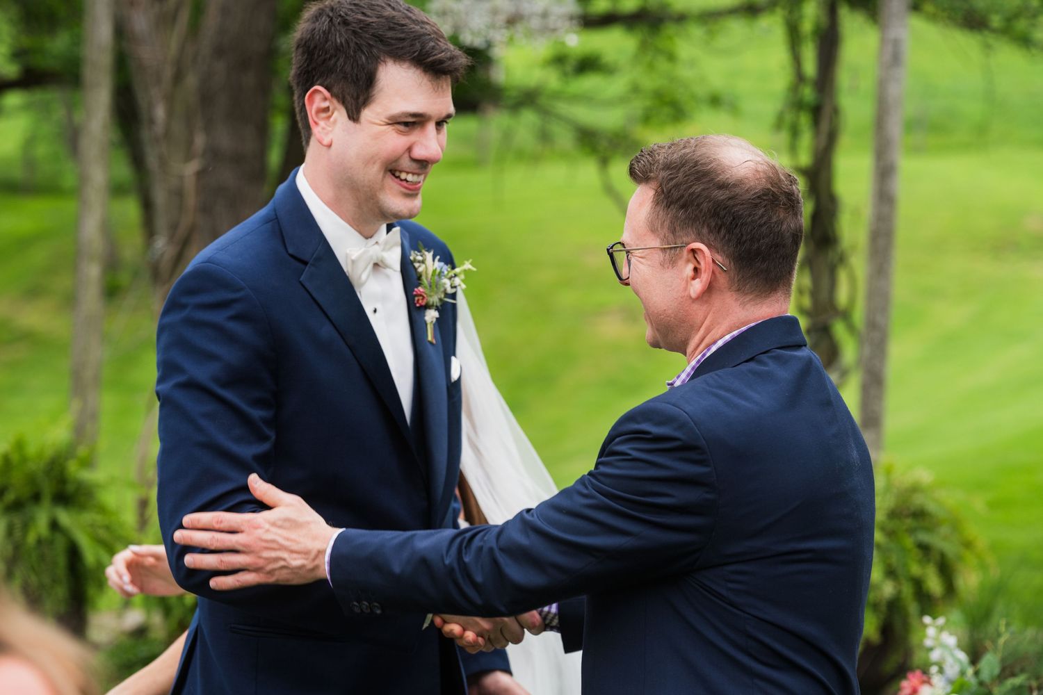 Emotional greetings and embraces at outdoor wedding ceremony.  at shady elms farm pittsburgh pa photography and video