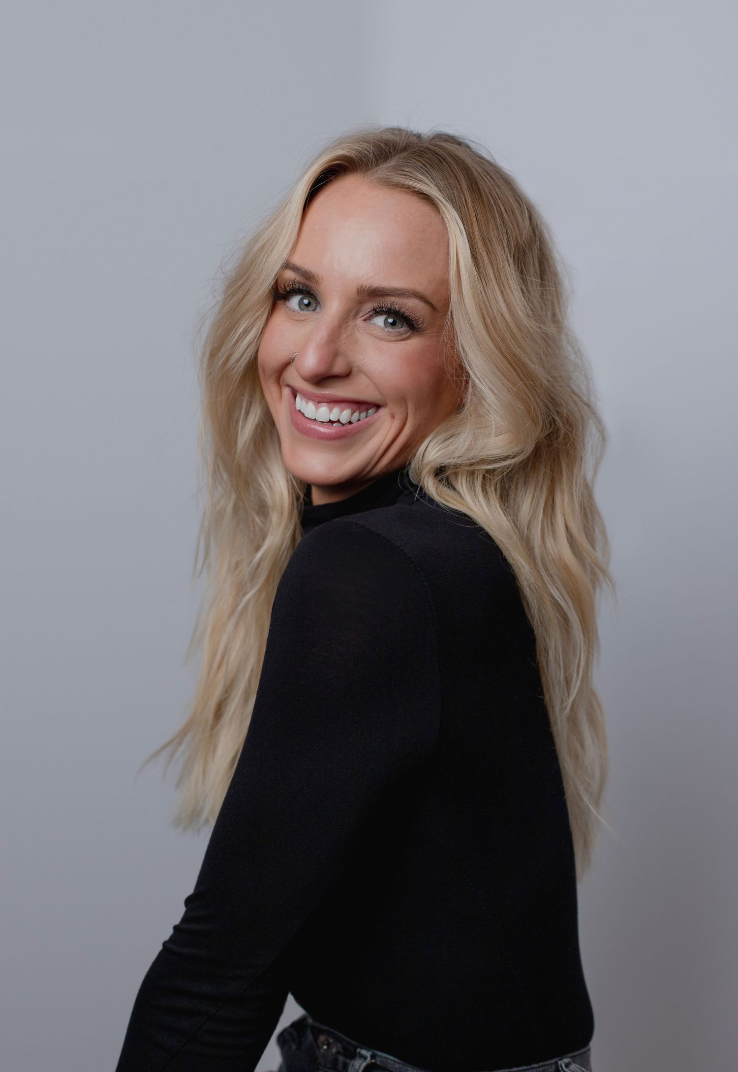 Gorgeous fresh portrait of young female entrepreneur in a modern studio setting by Abby Gleason Photography