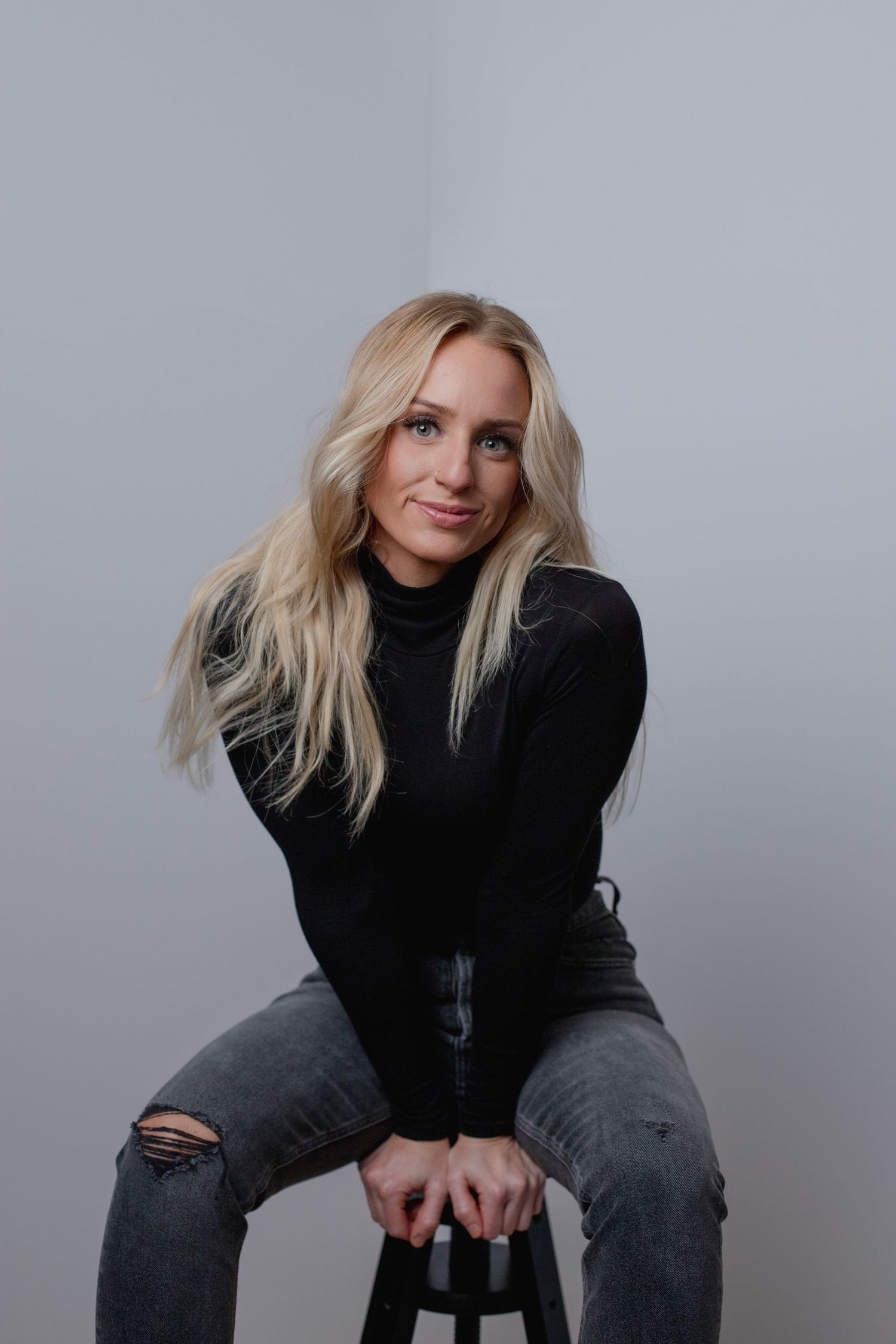 Casual portrait of young female entrepreneur in a South Hills studio by Abby Gleason Photography