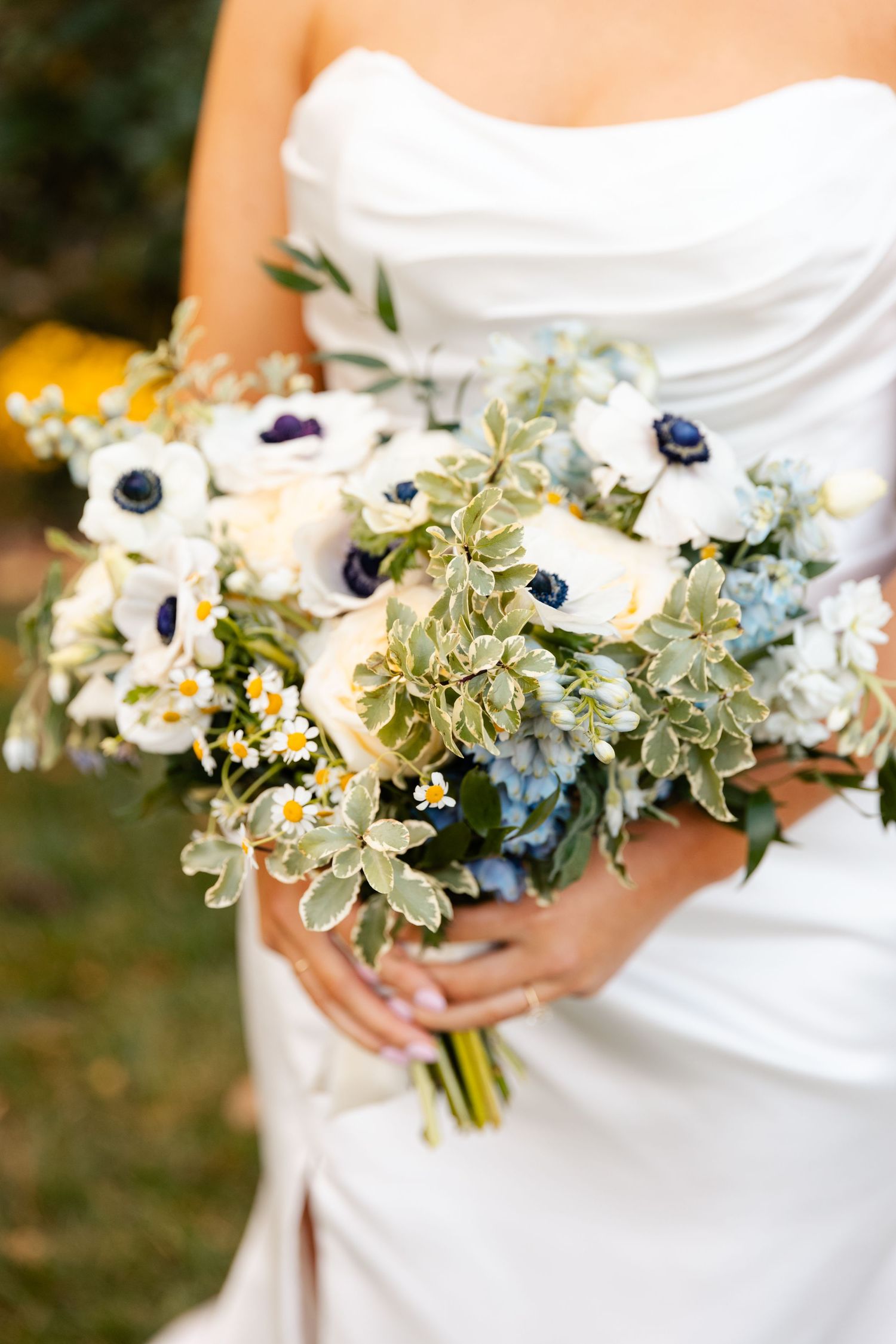 Bridal bouquet with fresh white anemone and greenery at fall wedding at Bedford Village Inn in Bedford, NH