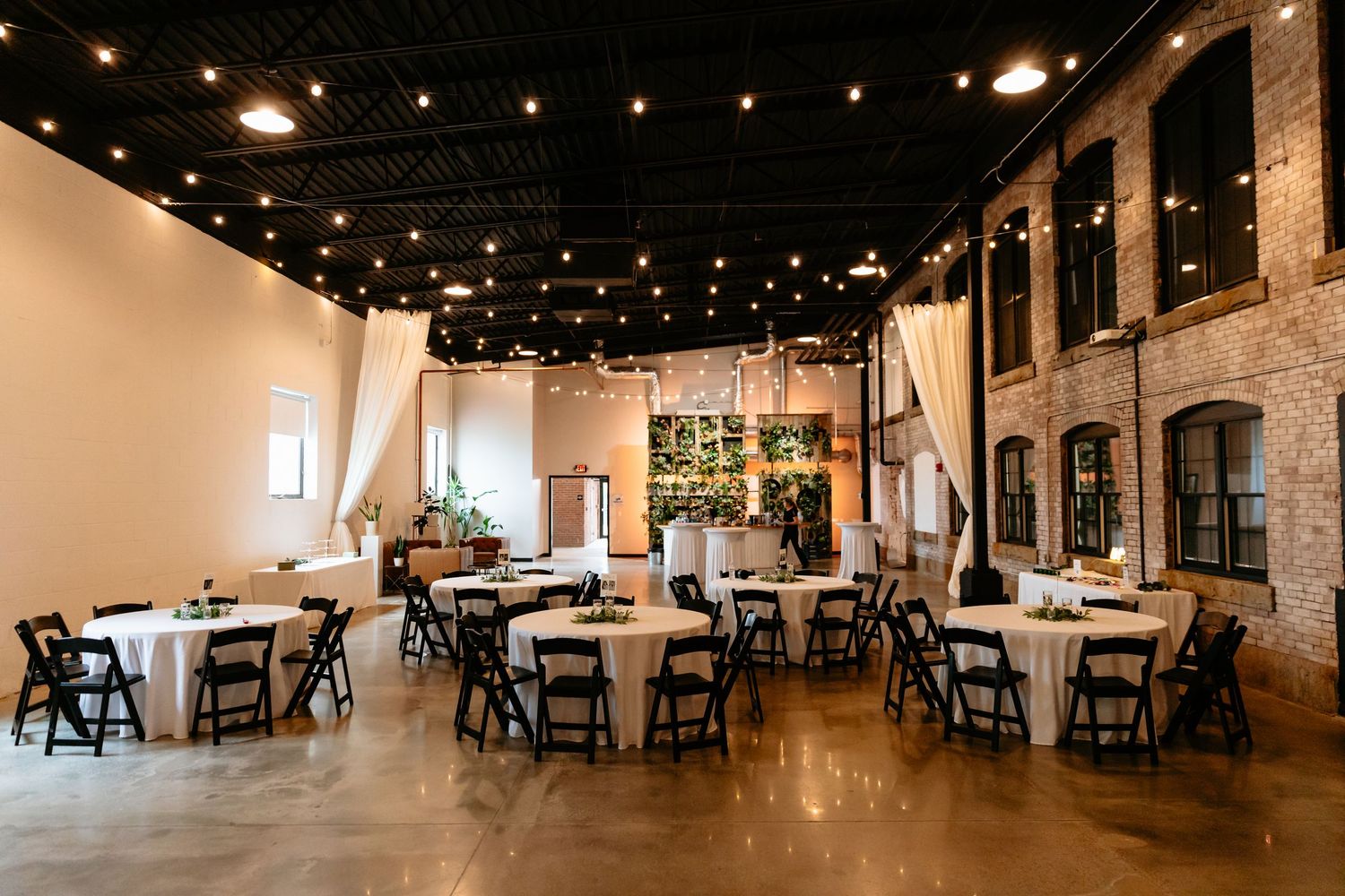 Venues at the Factory wedding Manchester NH industrial wedding with bricks and string lights