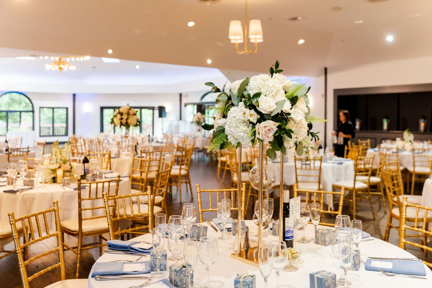 Granite Rose NH wedding reception area floral centerpieces gold Chiavari chairs blush florals