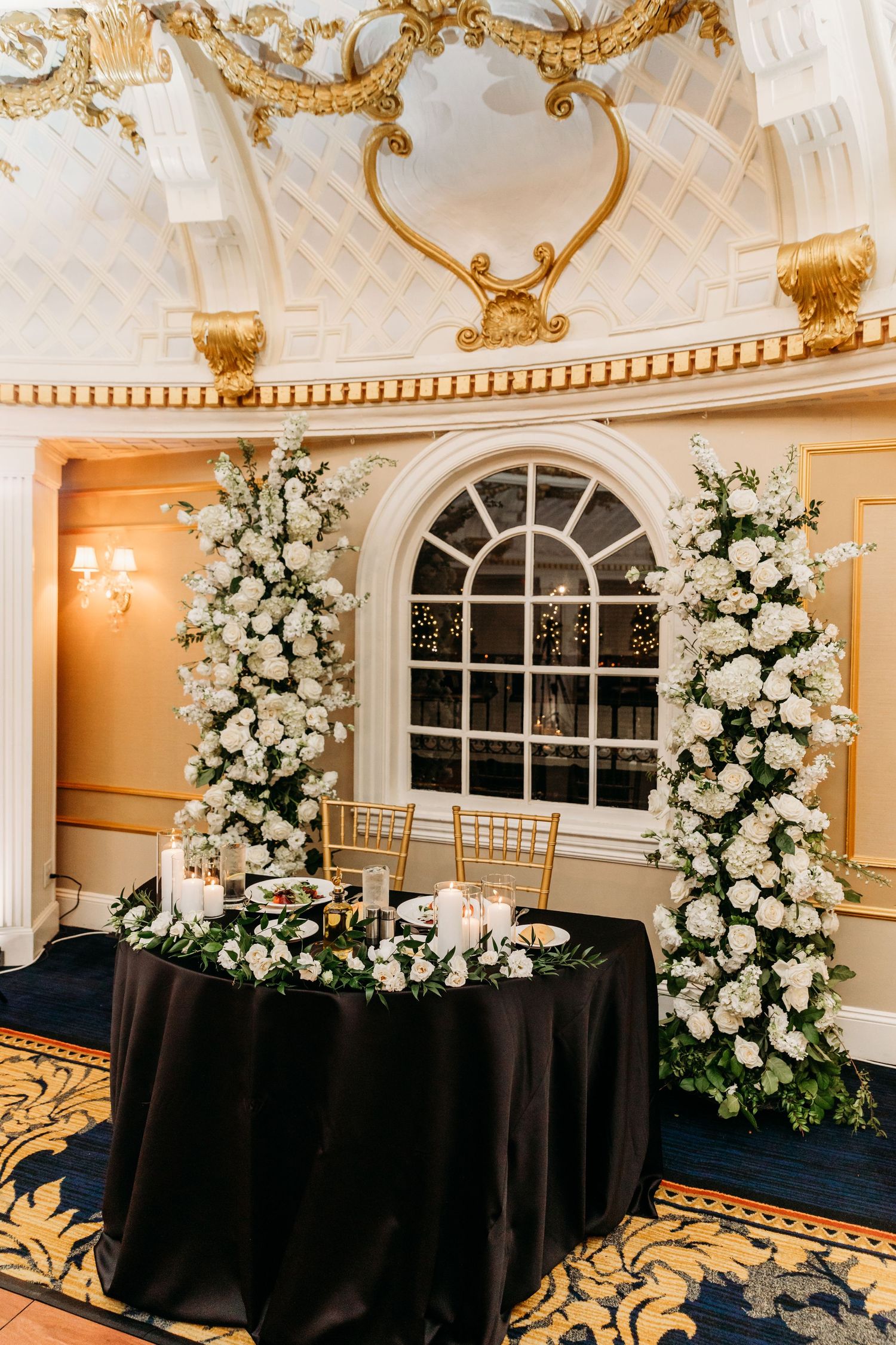 Lenox Hotel Boston Wedding Dome Room head table with floral centerpieces and arbor
