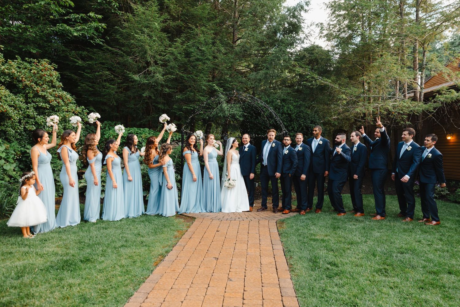 Granite Rose NH wedding ceremony bridal party in courtyard summer wedding