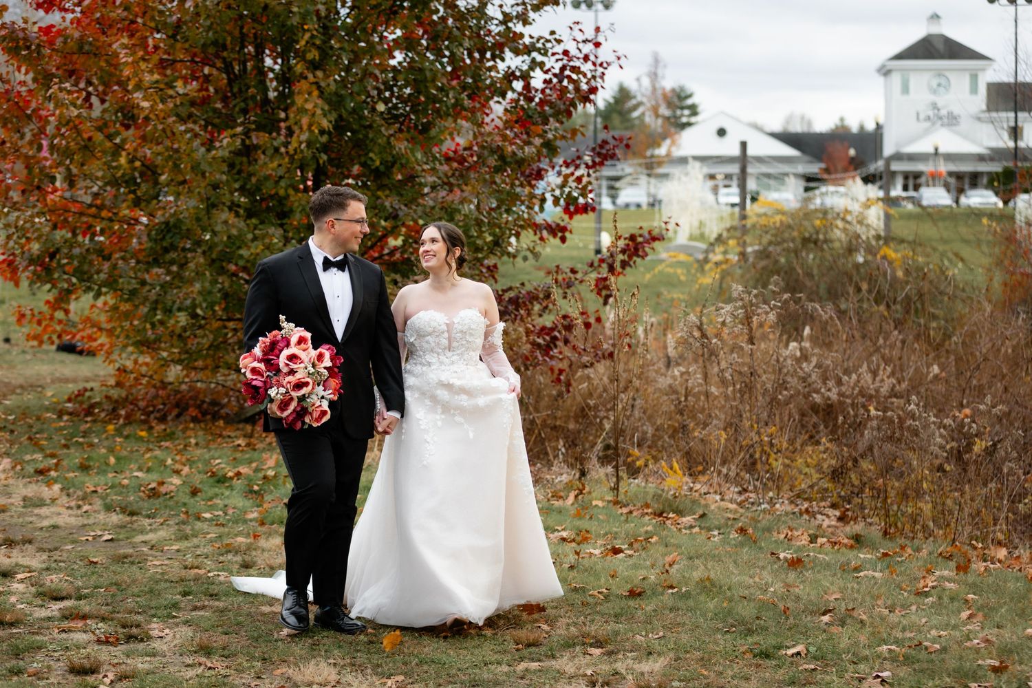 Labelle Winery wedding Derry NH Fall bride and groom portraits in vineyard foliage November